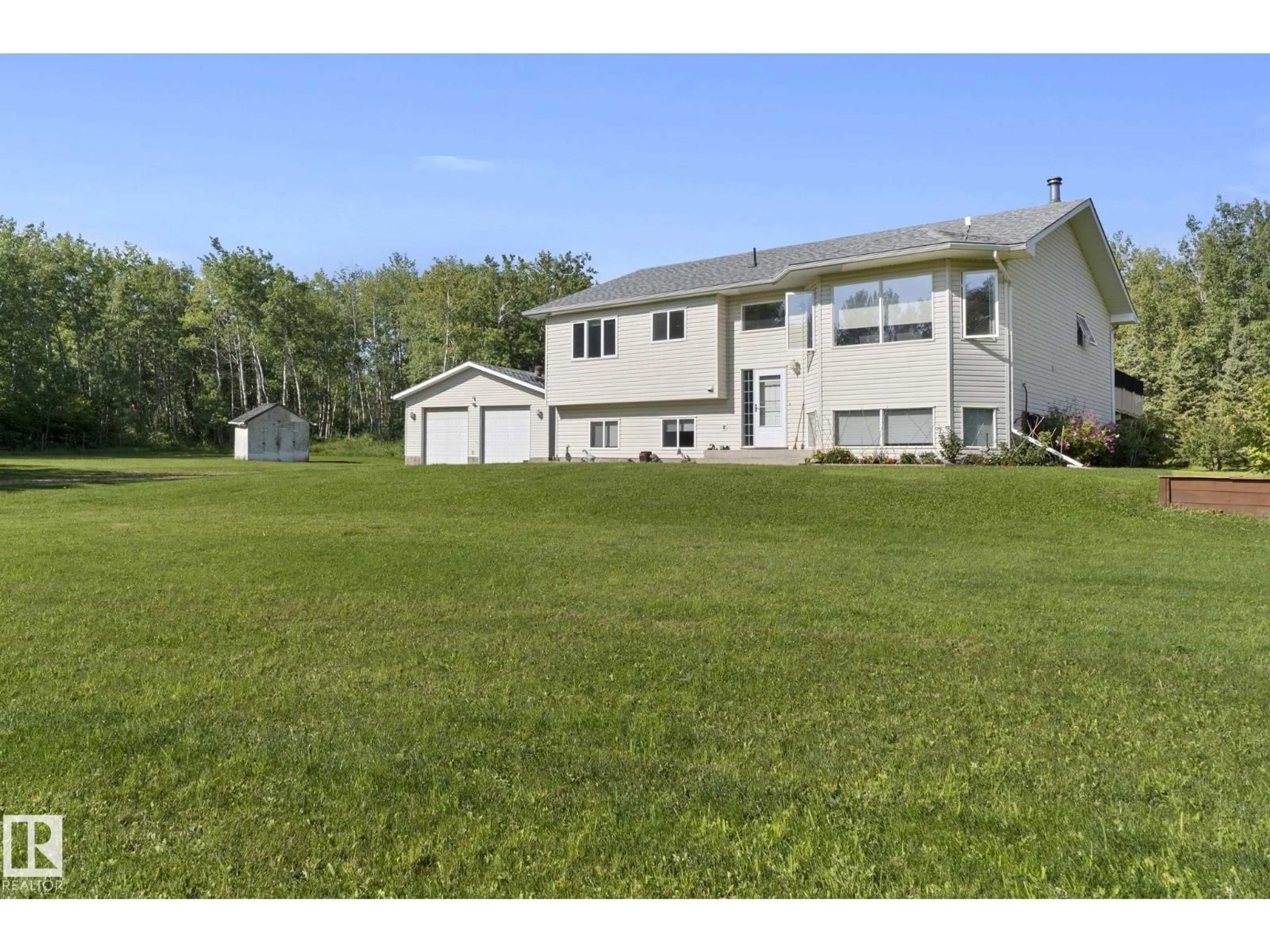 A pic from outside/outdoor area/front of a property/back of a property/a pic from drone, unknown for #4 - 53222 RGE ROAD 34, Rural Parkland County Alberta T0E0N0