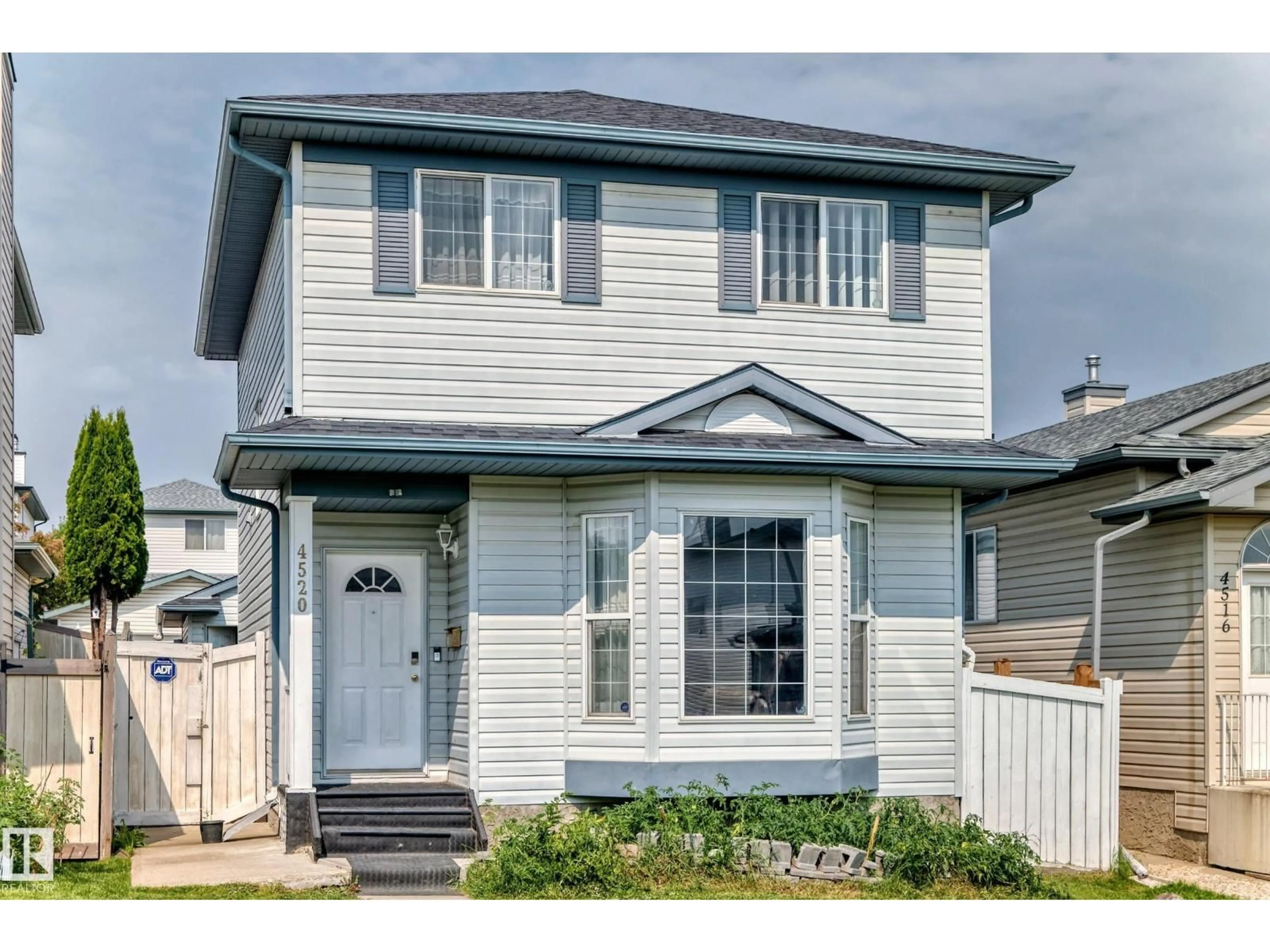 Home with vinyl exterior material, street for 4520 149 AV, Edmonton Alberta T5Y2Z1