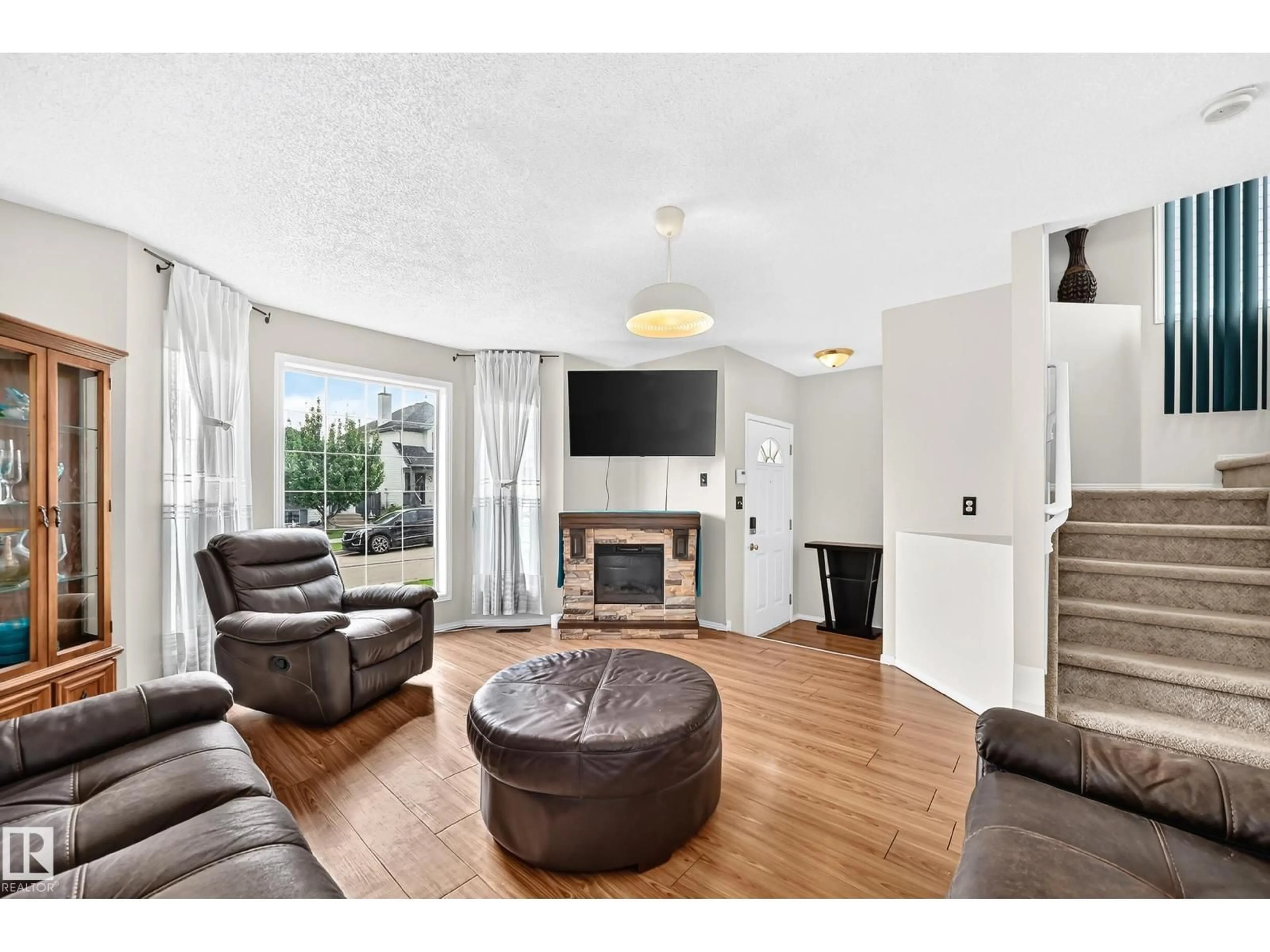 Living room with furniture, unknown for 4520 149 AV, Edmonton Alberta T5Y2Z1