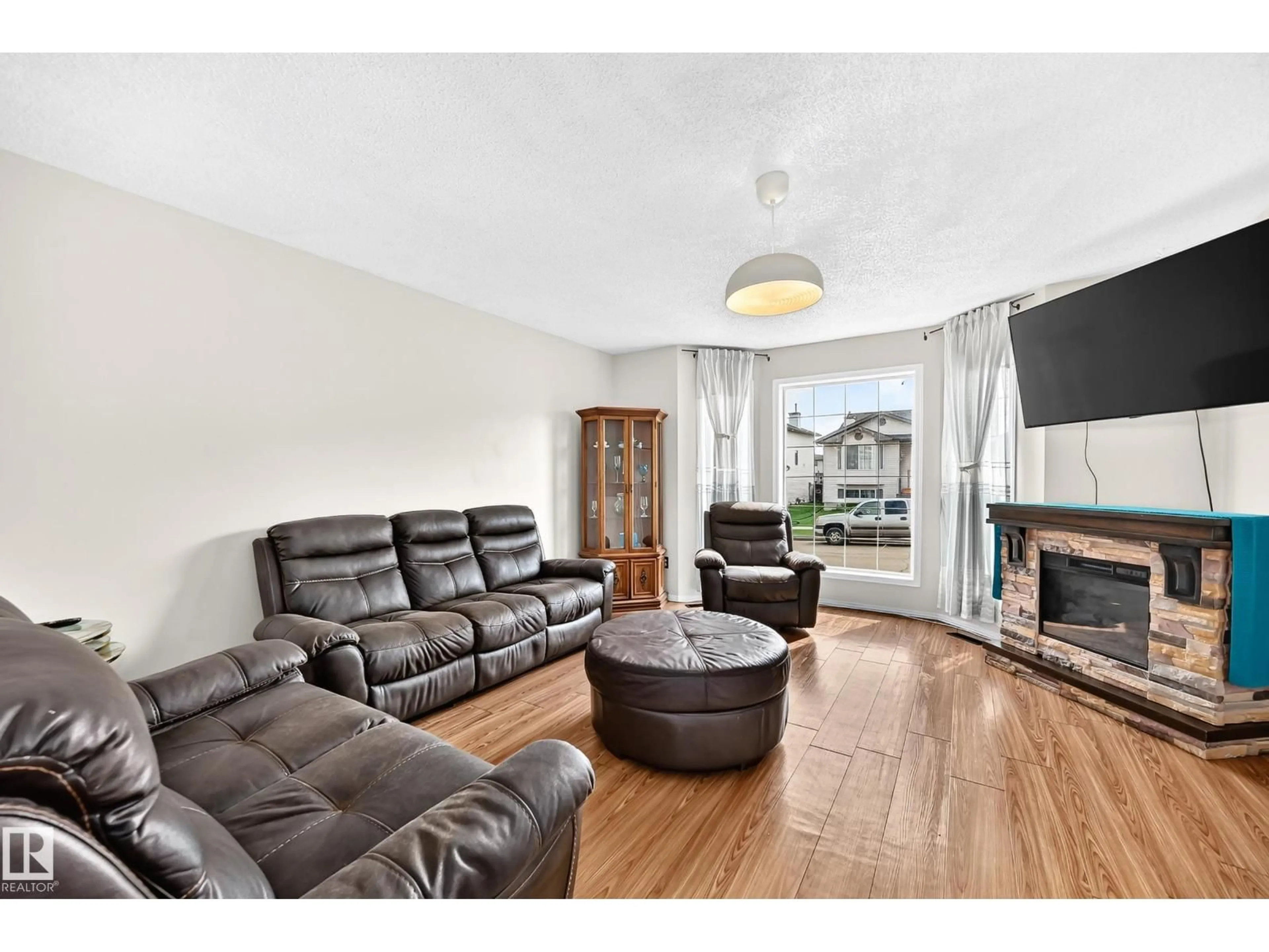 Living room with furniture, unknown for 4520 149 AV, Edmonton Alberta T5Y2Z1