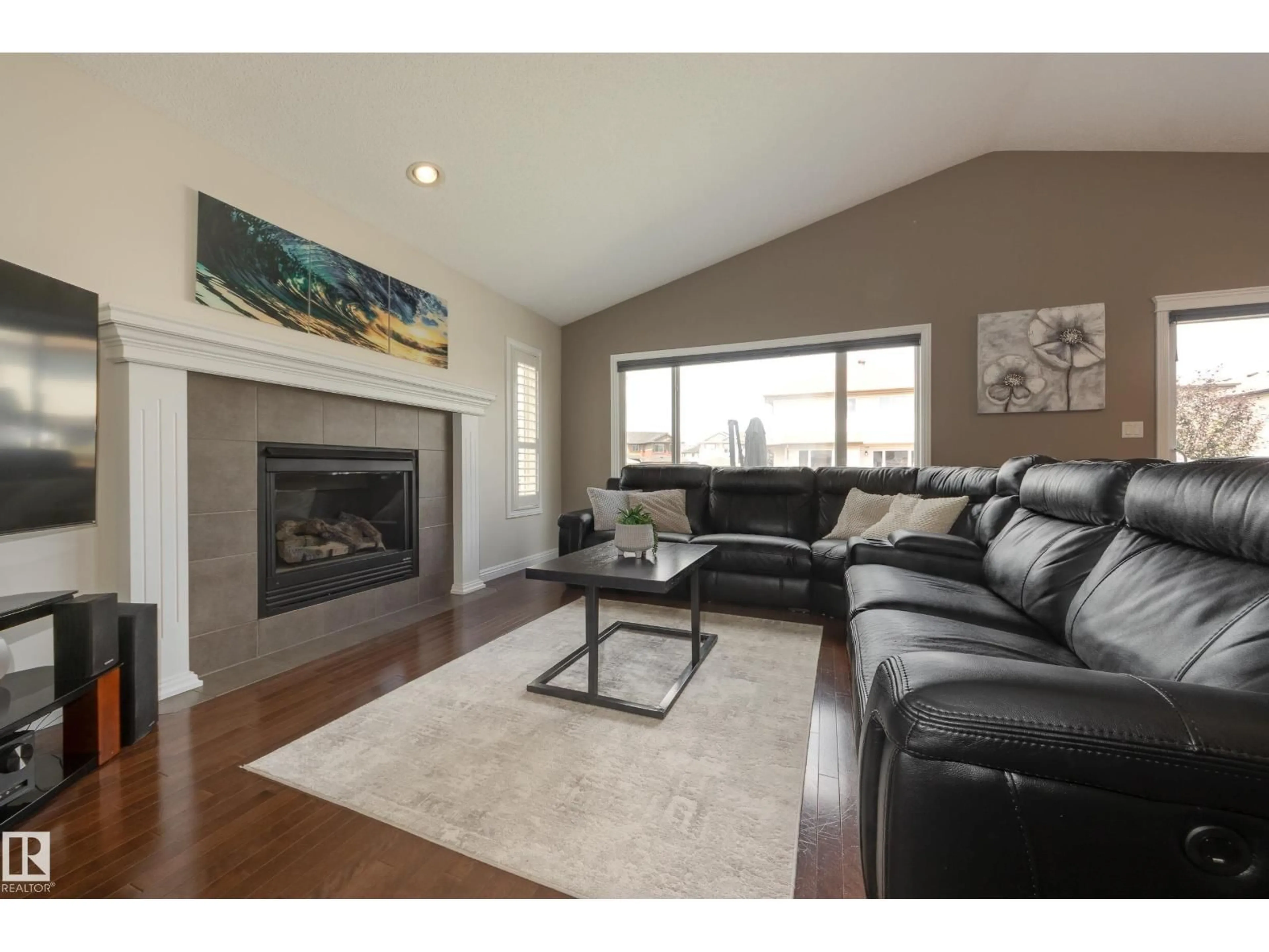 Living room with furniture, wood/laminate floor for 14040 145 AV, Edmonton Alberta T6V1Y2