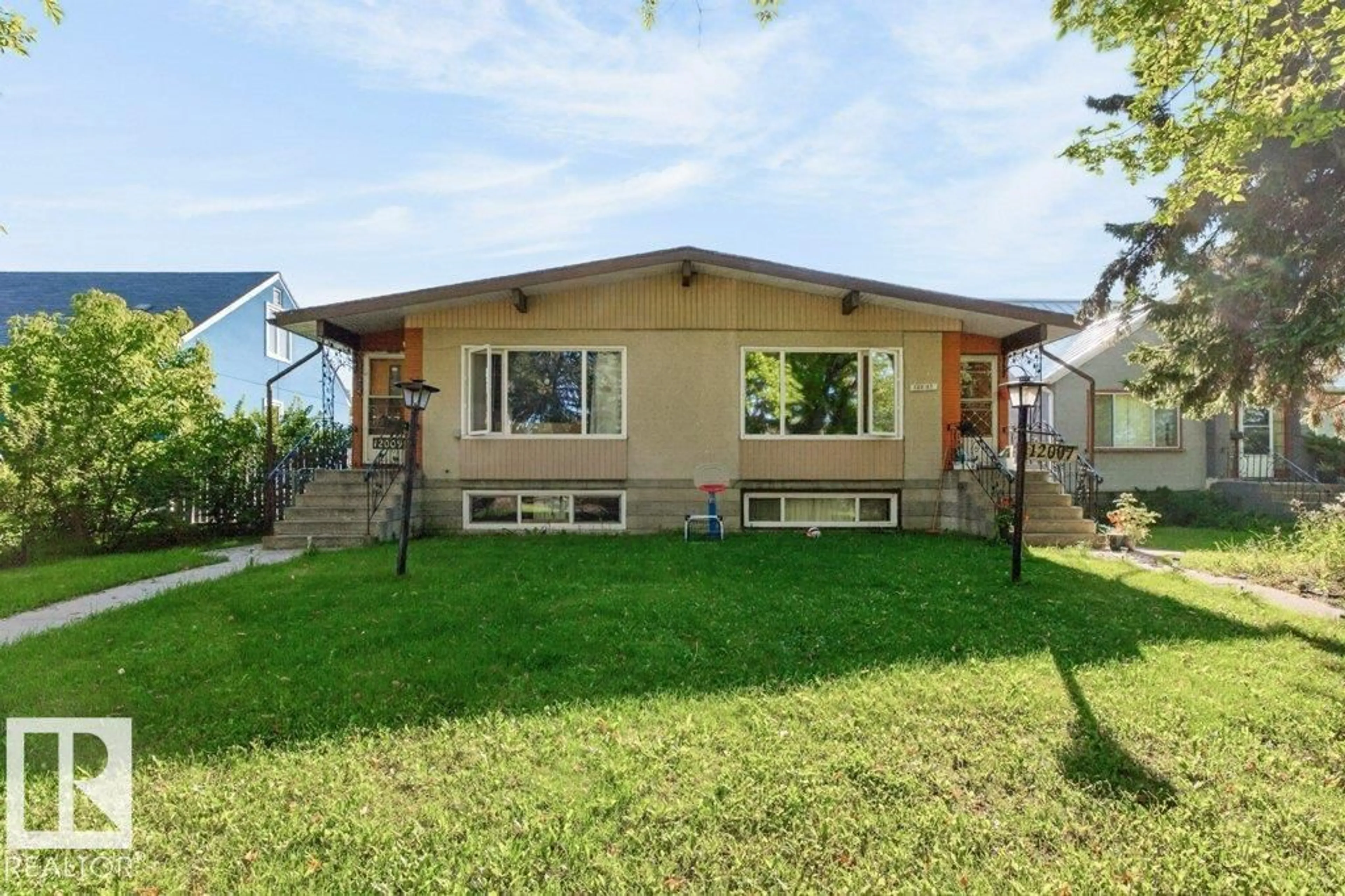 Home with vinyl exterior material, street for NW - 12007 104 ST, Edmonton Alberta T5G2L5