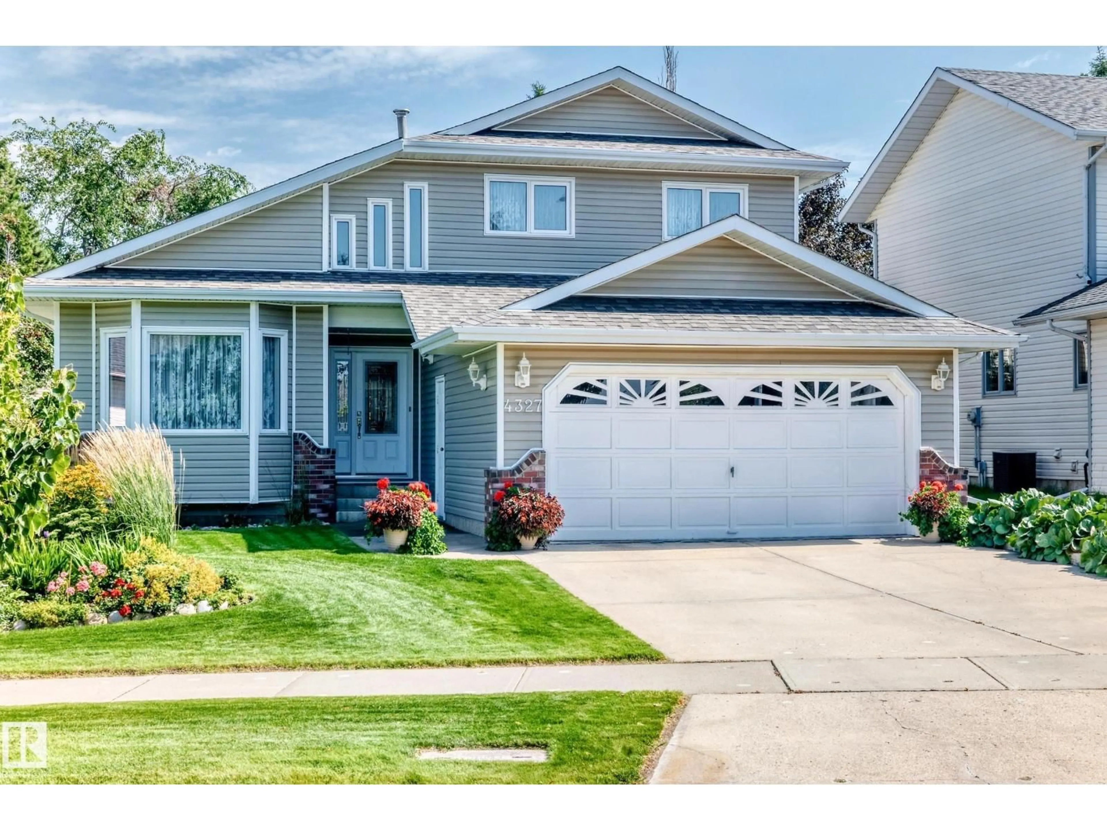 Home with vinyl exterior material, street for NW - 4327 49 ST, Edmonton Alberta T6L6J5