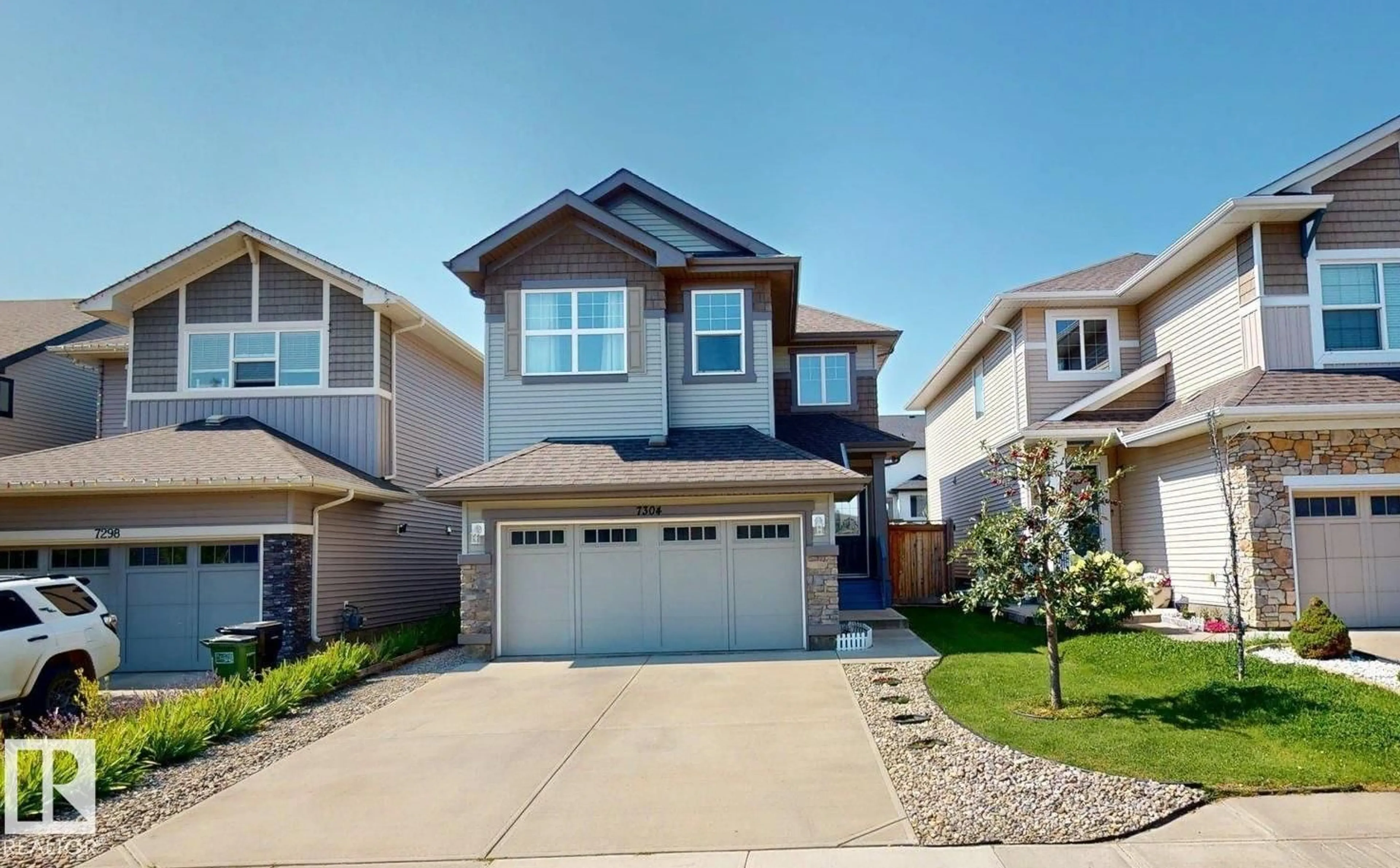 Home with vinyl exterior material, street for NW - 7304 EDGEMONT WY, Edmonton Alberta T6M0S1