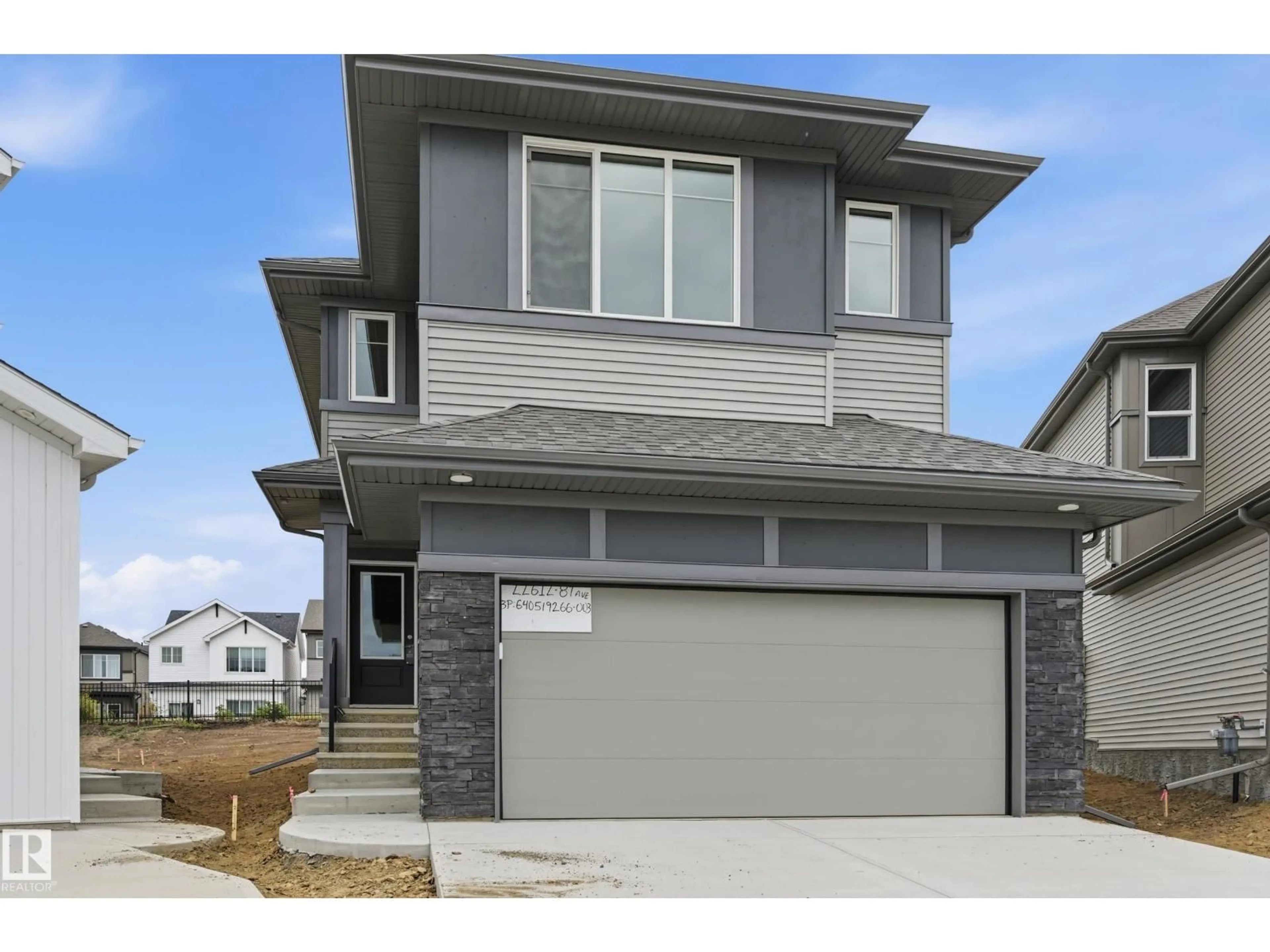 Home with vinyl exterior material, street for NW - 22615 89 AV, Edmonton Alberta T5T7W8