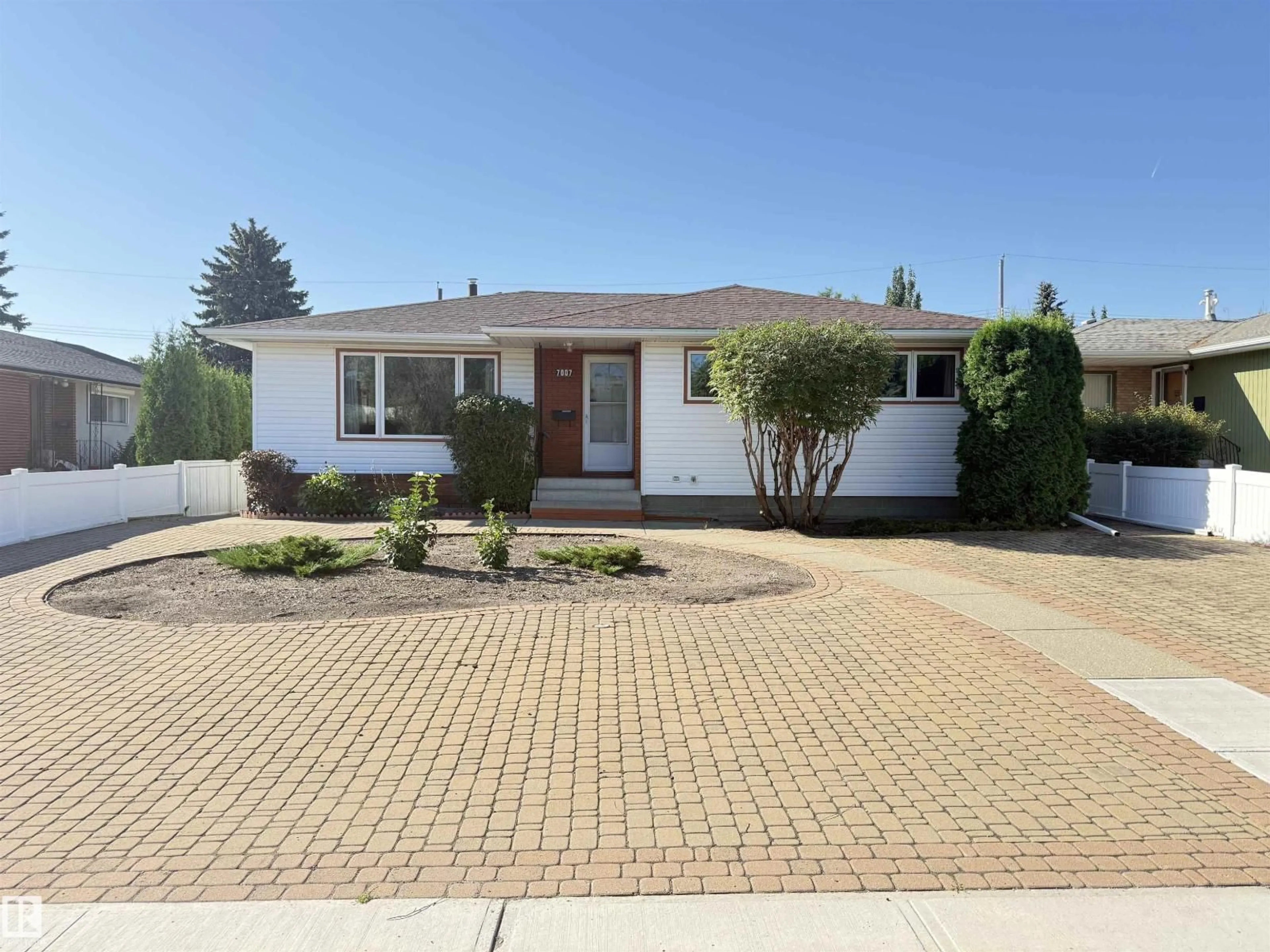 Home with brick exterior material, street for 7007 91 AV, Edmonton Alberta T6B0R5