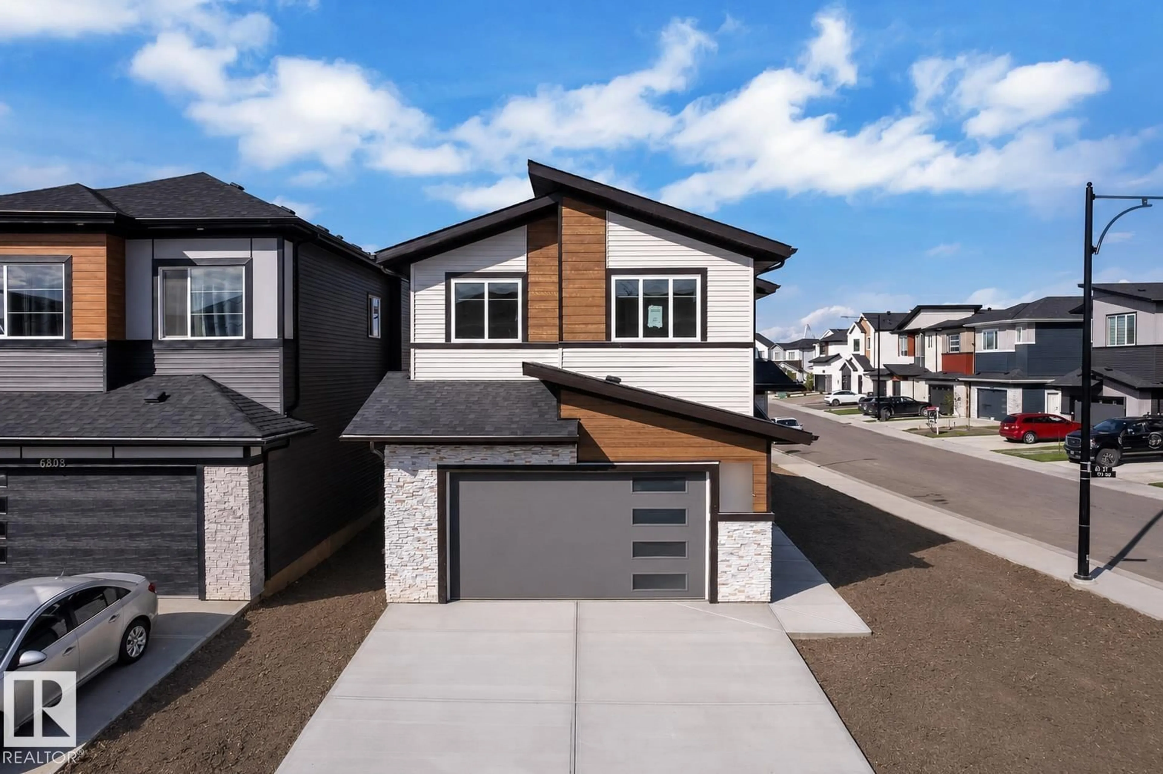 Home with vinyl exterior material, street for 6804 173 AVE, Edmonton Alberta T5Z0W4