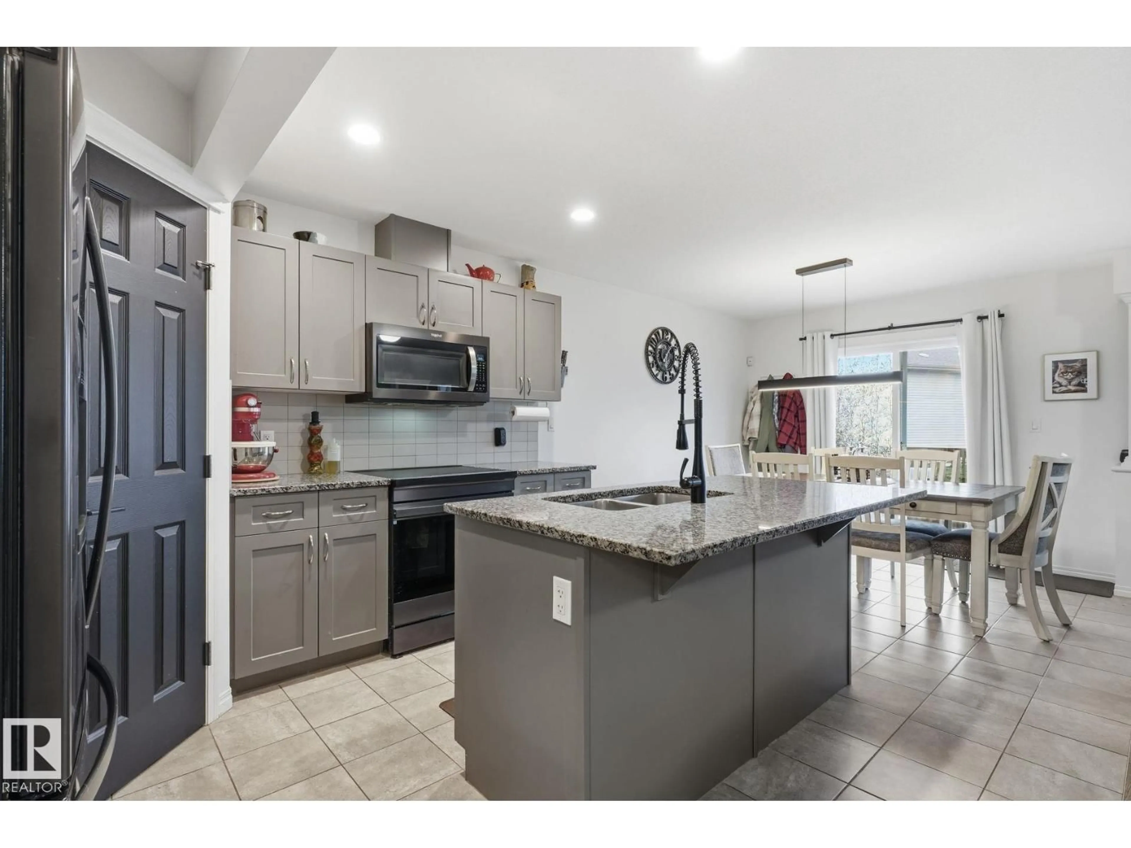 Open concept kitchen, ceramic/tile floor for 12825 207 ST, Edmonton Alberta T5S0K2
