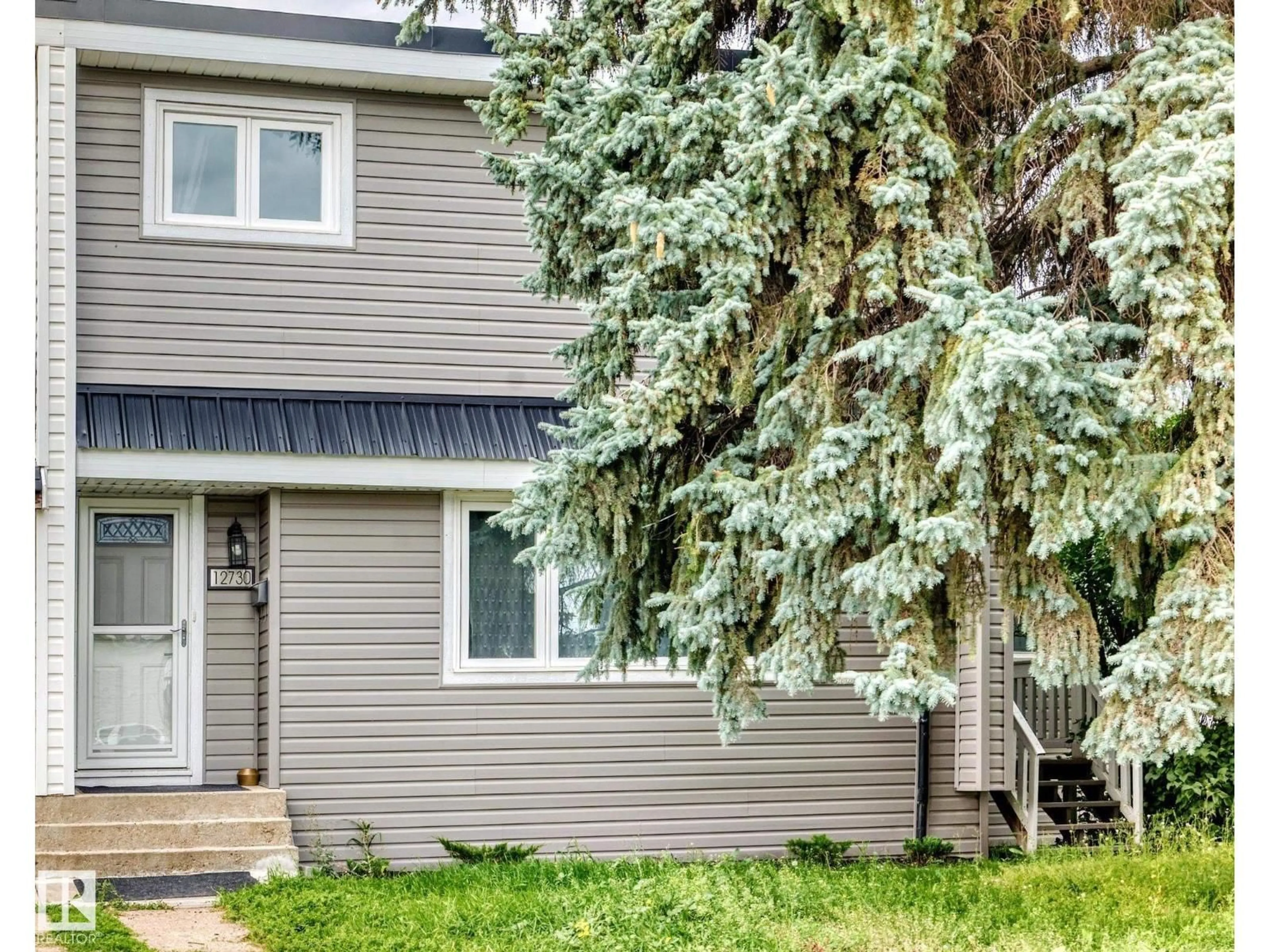 Home with vinyl exterior material, street for NW - 12730 90 ST, Edmonton Alberta T5E3L6