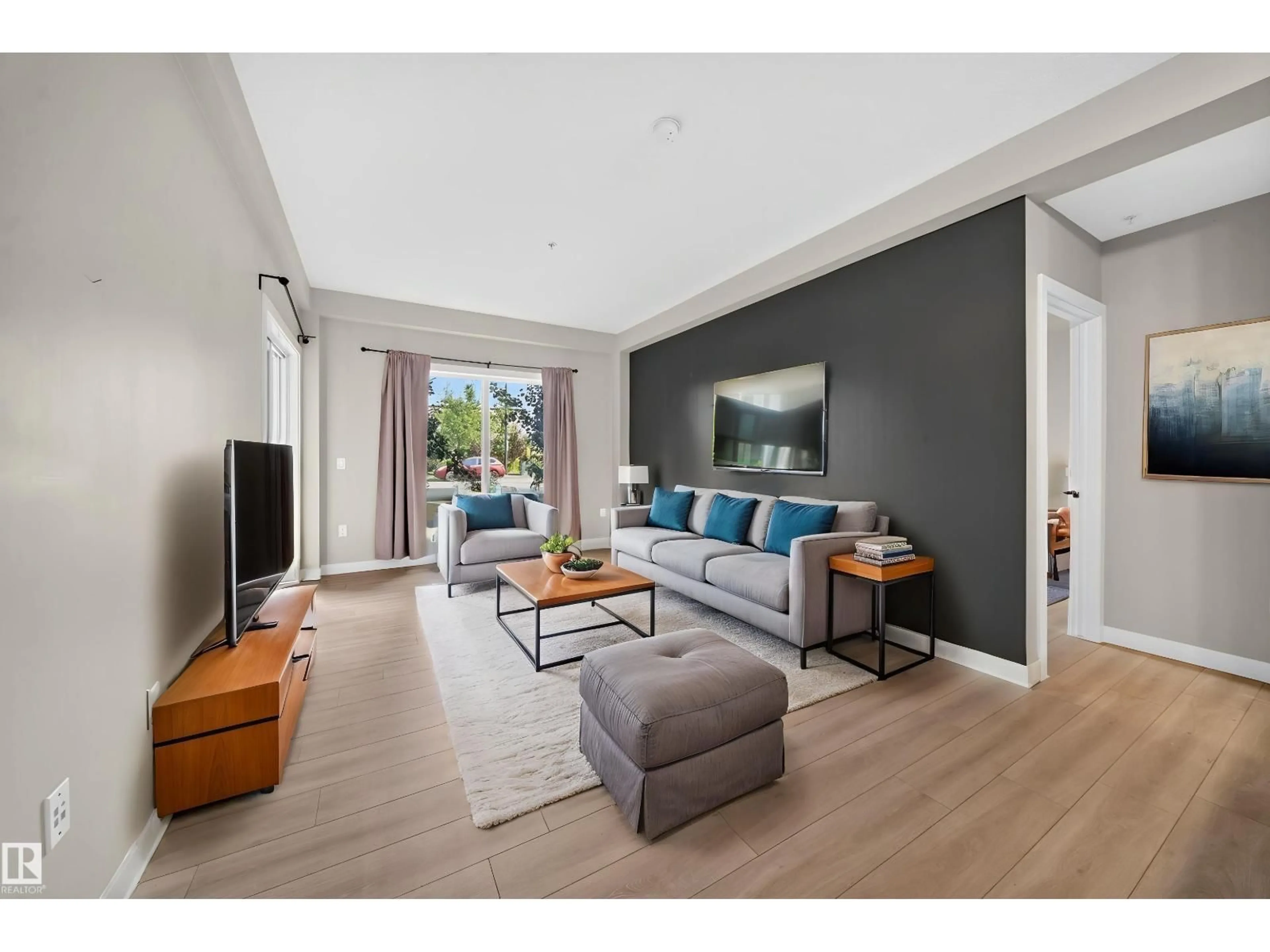 Living room with furniture, unknown for #115 - 1238 WINDERMERE WY, Edmonton Alberta T6W2J3