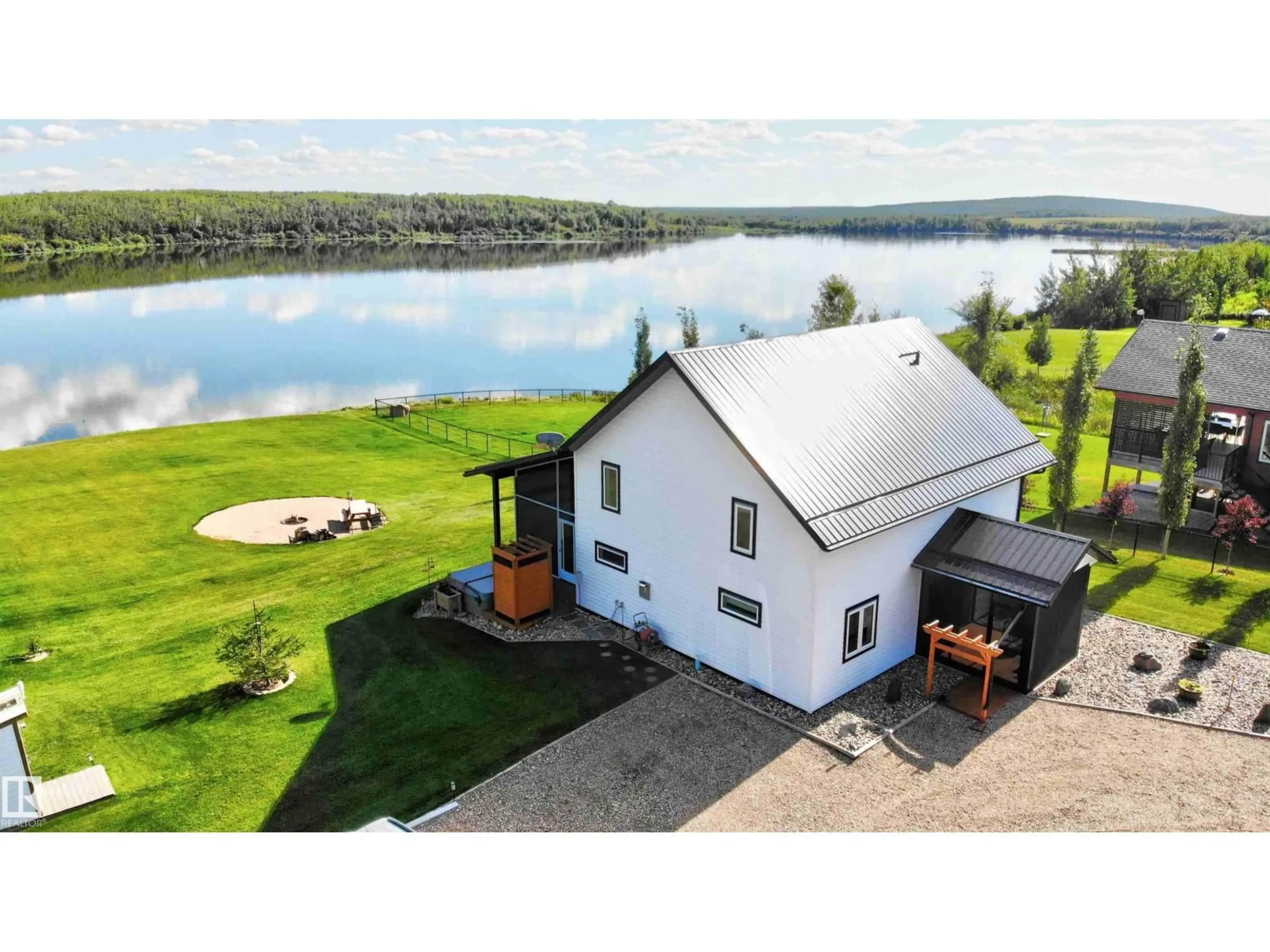 A pic from outside/outdoor area/front of a property/back of a property/a pic from drone, water/lake/river/ocean view for 735 56512 RR 111, Rural St. Paul County Alberta T0A2G0