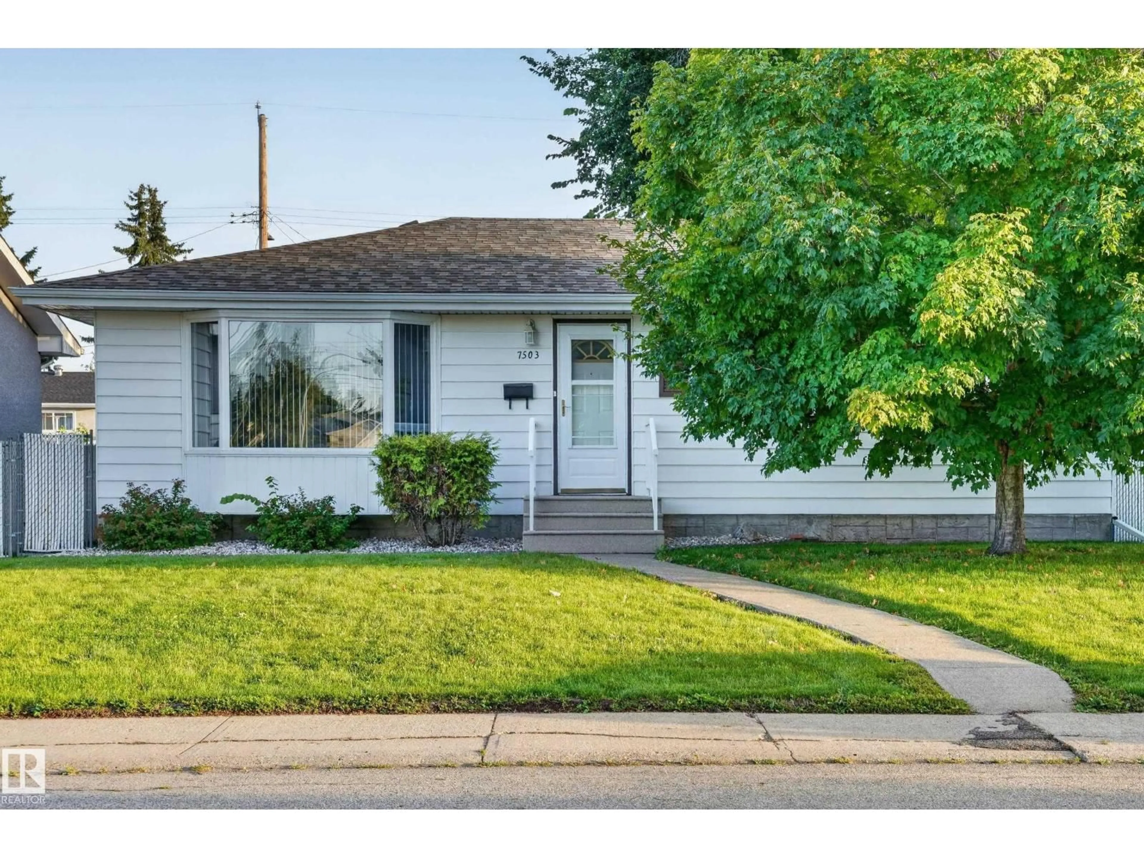 Home with vinyl exterior material, street for NW - 7503 135A AV, Edmonton Alberta T5C2J2