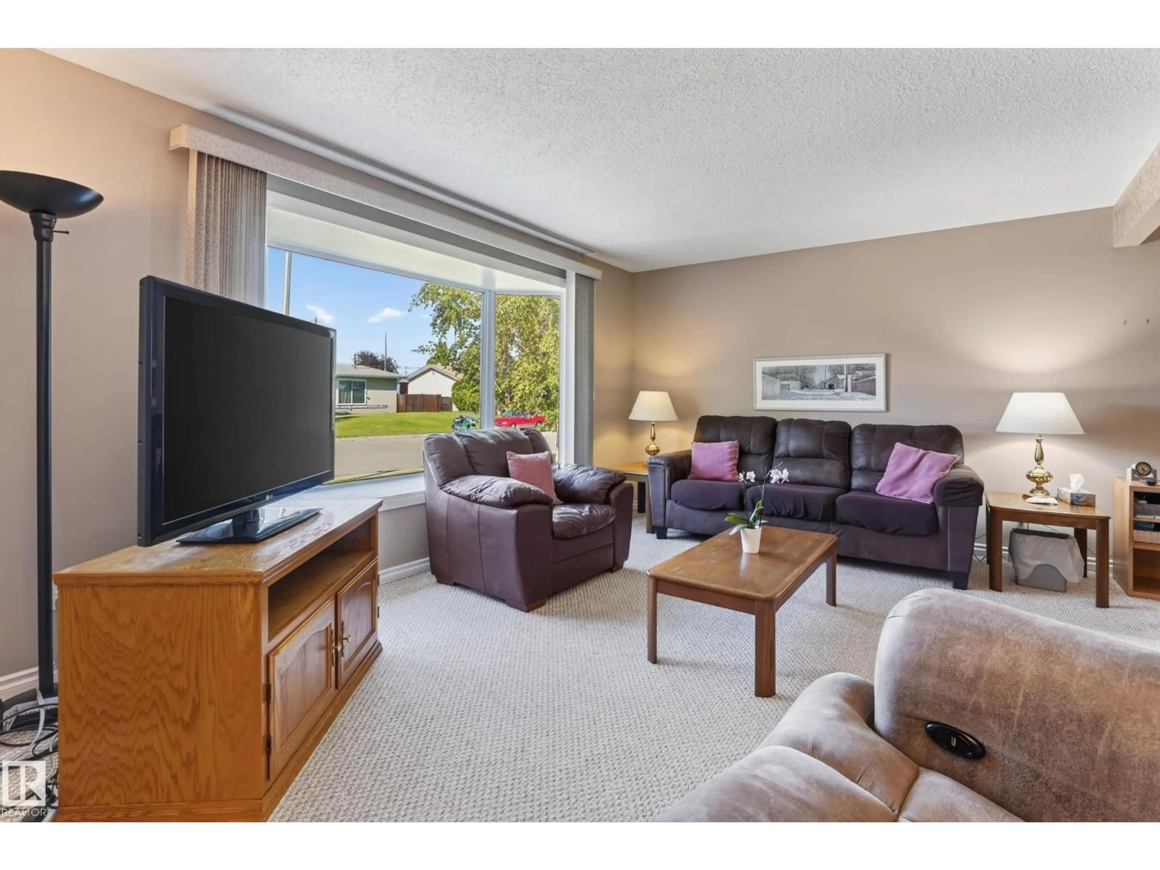 Living room with furniture, unknown for NW - 7503 135A AV, Edmonton Alberta T5C2J2