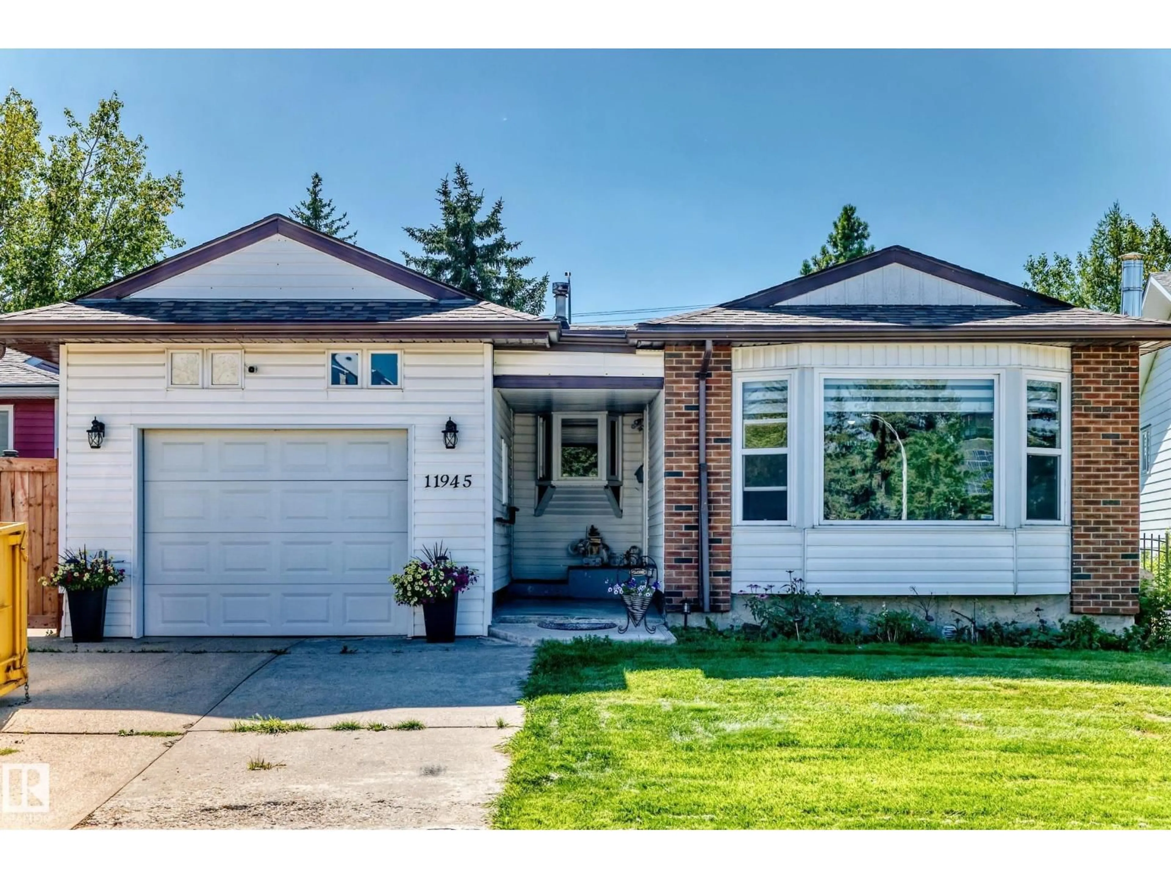 Home with brick exterior material, street for NW - 11945 138 AV, Edmonton Alberta T5X4K1