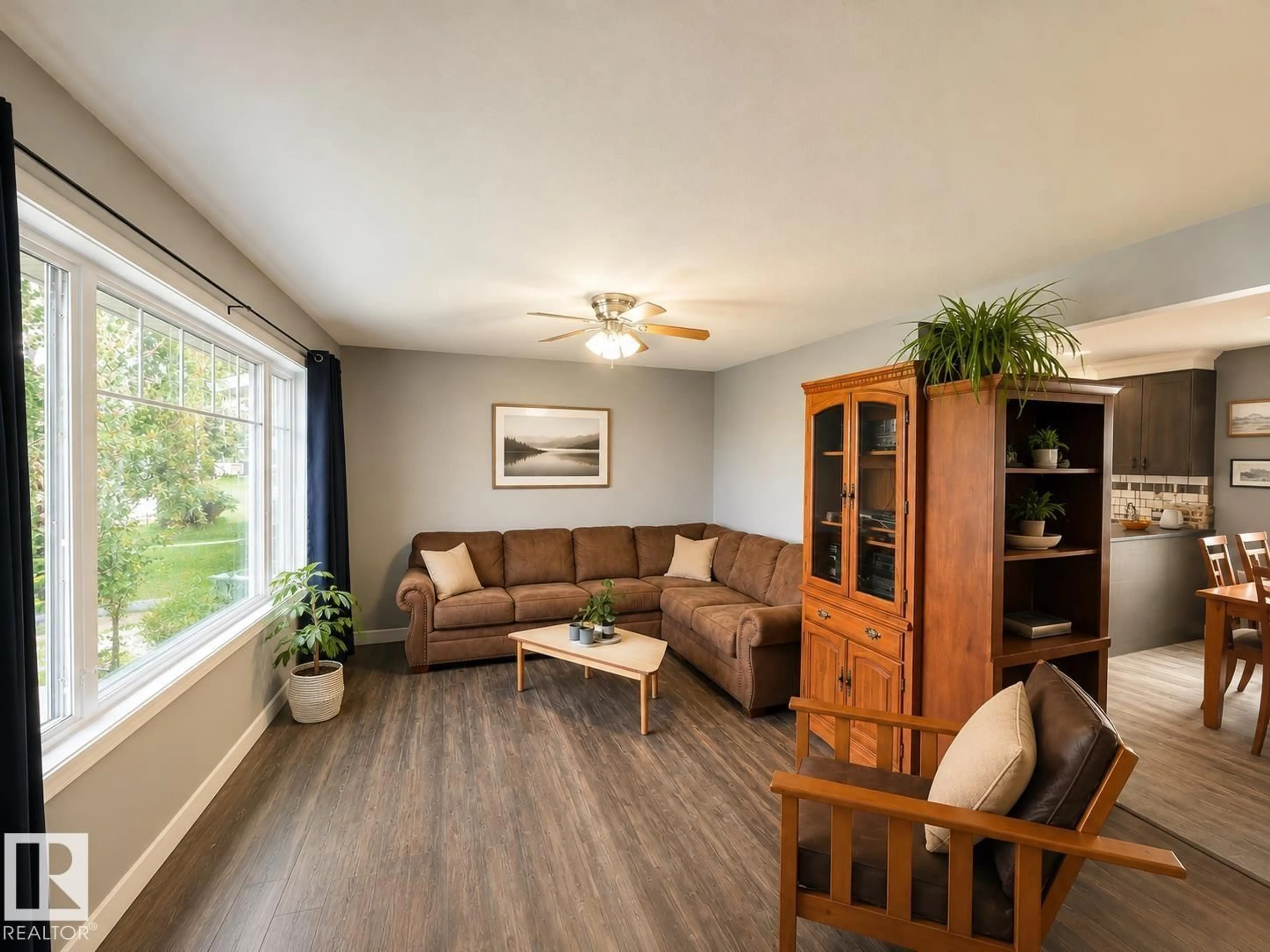 Living room with furniture, wood/laminate floor for 4706 44 ST, Bonnyville Town Alberta T9N1H1