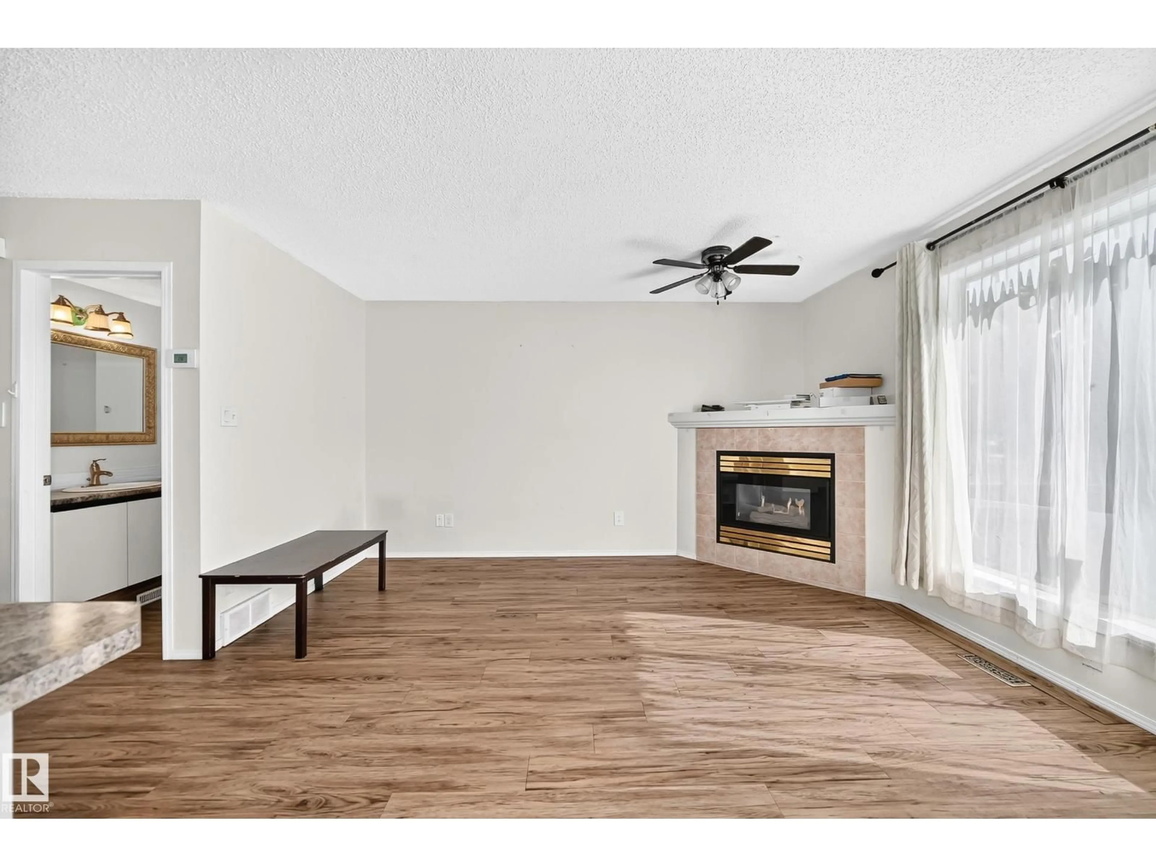 Living room with furniture, wood/laminate floor for #30 - 300 HOOPER CR, Edmonton Alberta T5A5B3