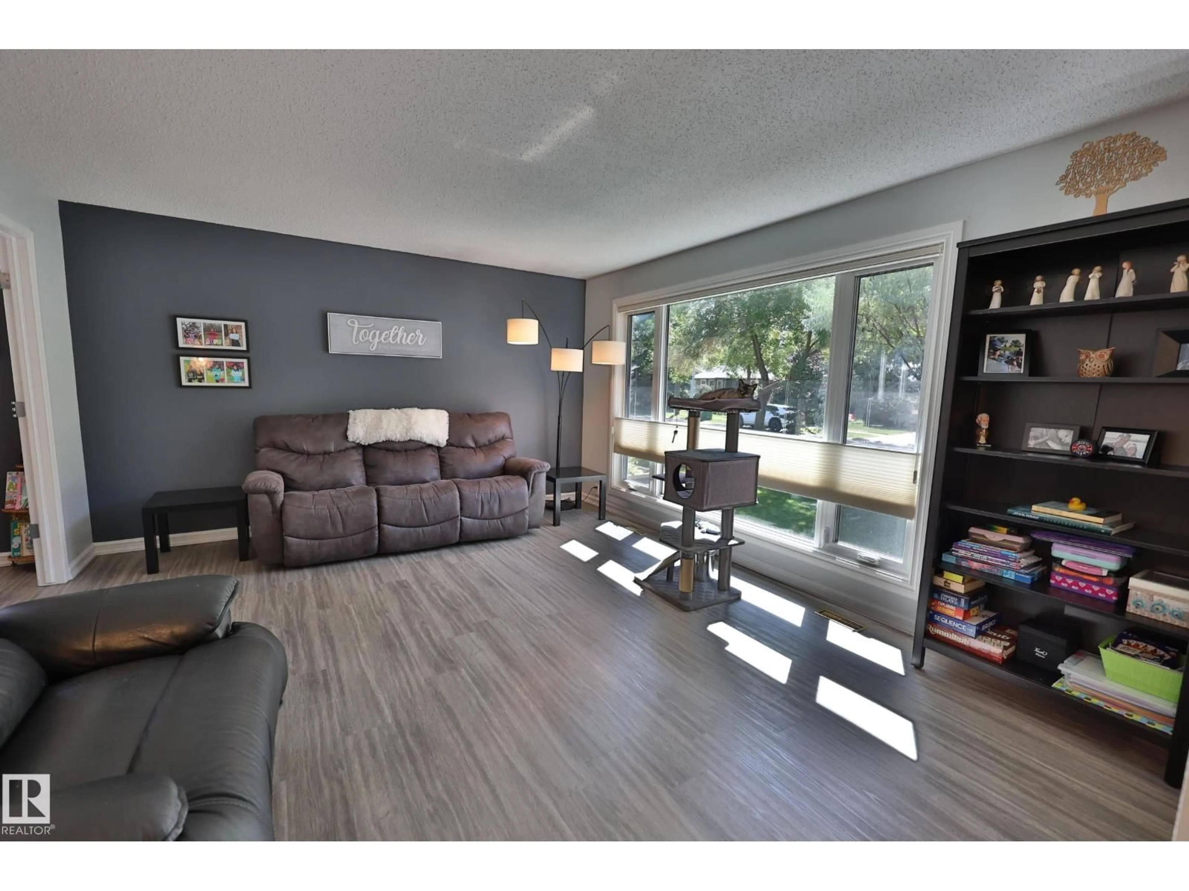 Living room with furniture, wood/laminate floor for 26 BUTTERFIELD CR, St. Albert Alberta T8N2W7