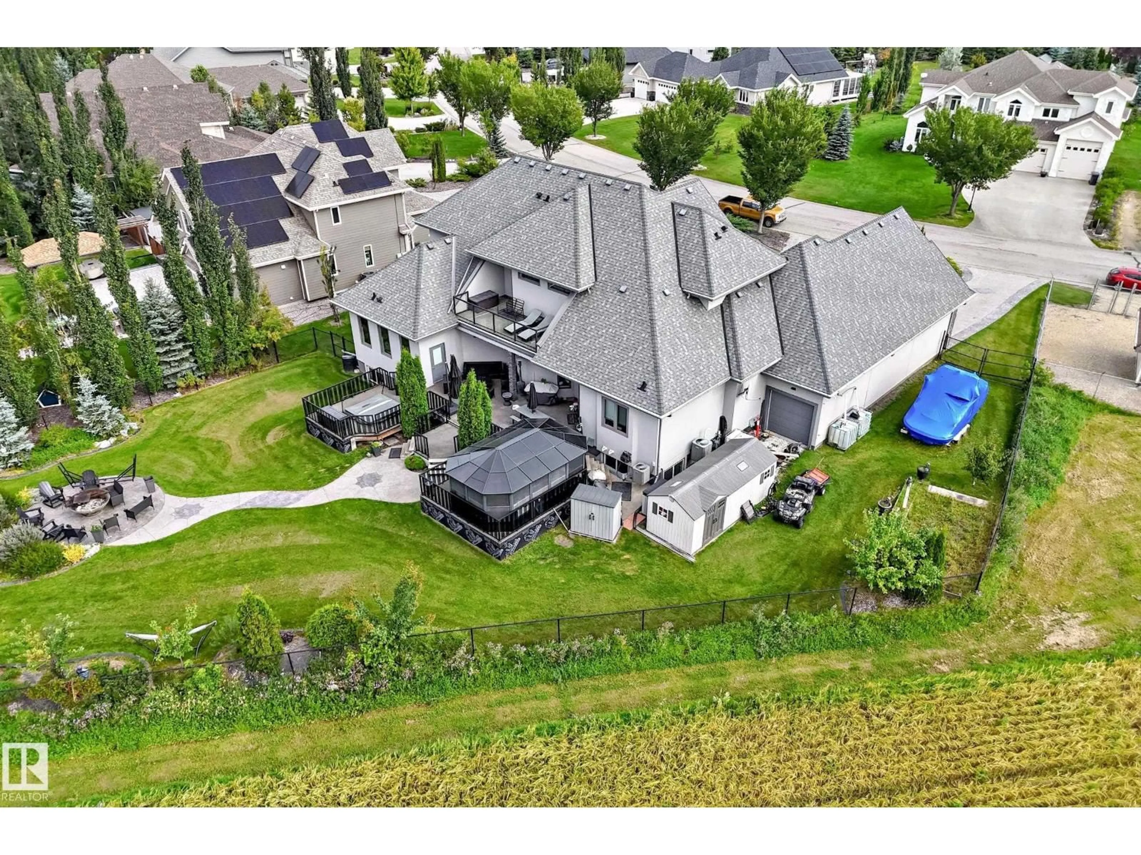 A pic from outside/outdoor area/front of a property/back of a property/a pic from drone, mountain view for 101 - 54302 RGE ROAD 250, Rural Sturgeon County Alberta T8T0C9