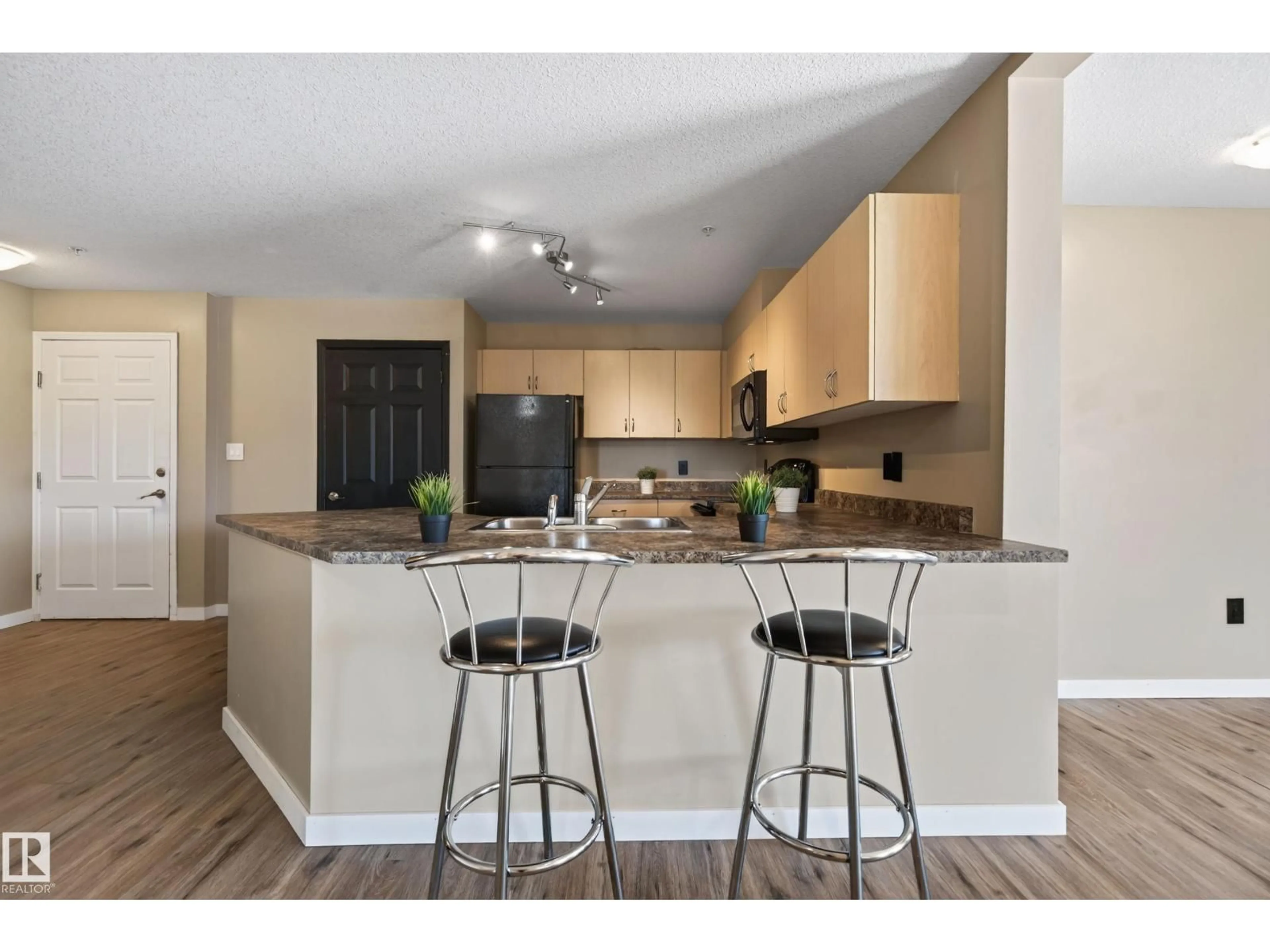 Open concept kitchen, wood/laminate floor for 42 - 222 SUMMERWOOD BV, Sherwood Park Alberta T8H0C3