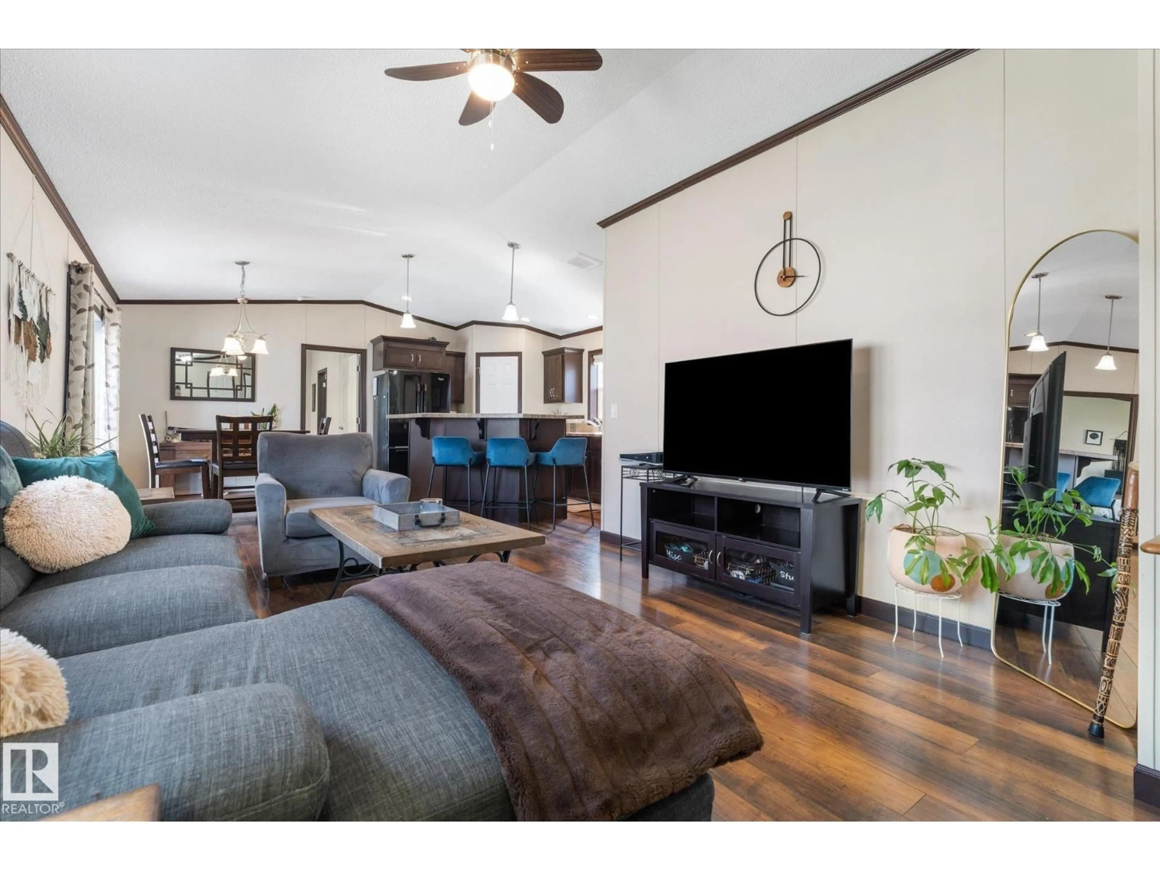 Living room with furniture, wood/laminate floor for 1435 53222 RGE RD RD, Rural Parkland County Alberta T7X4M4