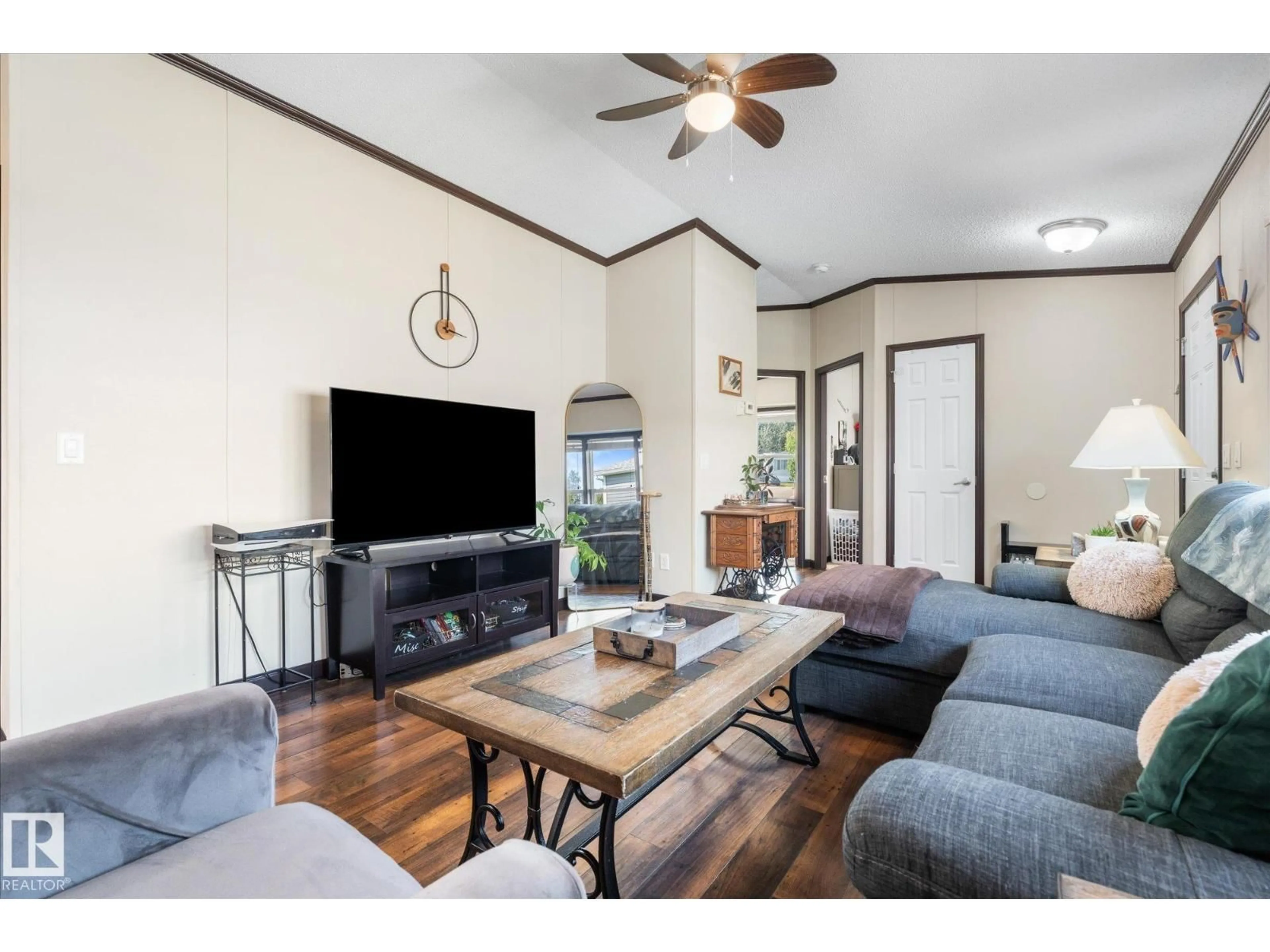 Living room with furniture, wood/laminate floor for 1435 53222 RGE RD RD, Rural Parkland County Alberta T7X4M4