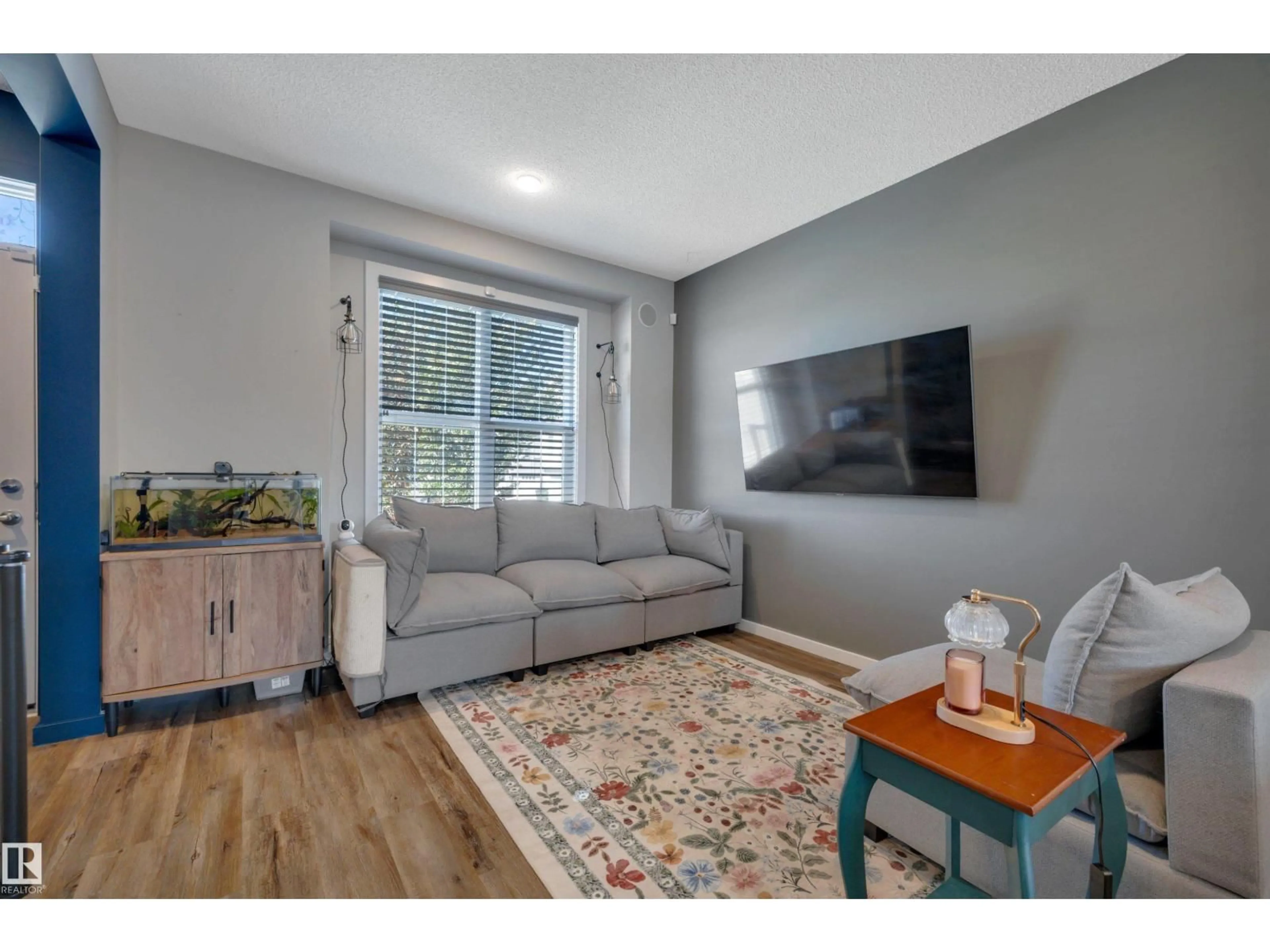 Living room with furniture, wood/laminate floor for 2605 MAPLE WY, Edmonton Alberta T6T2K1