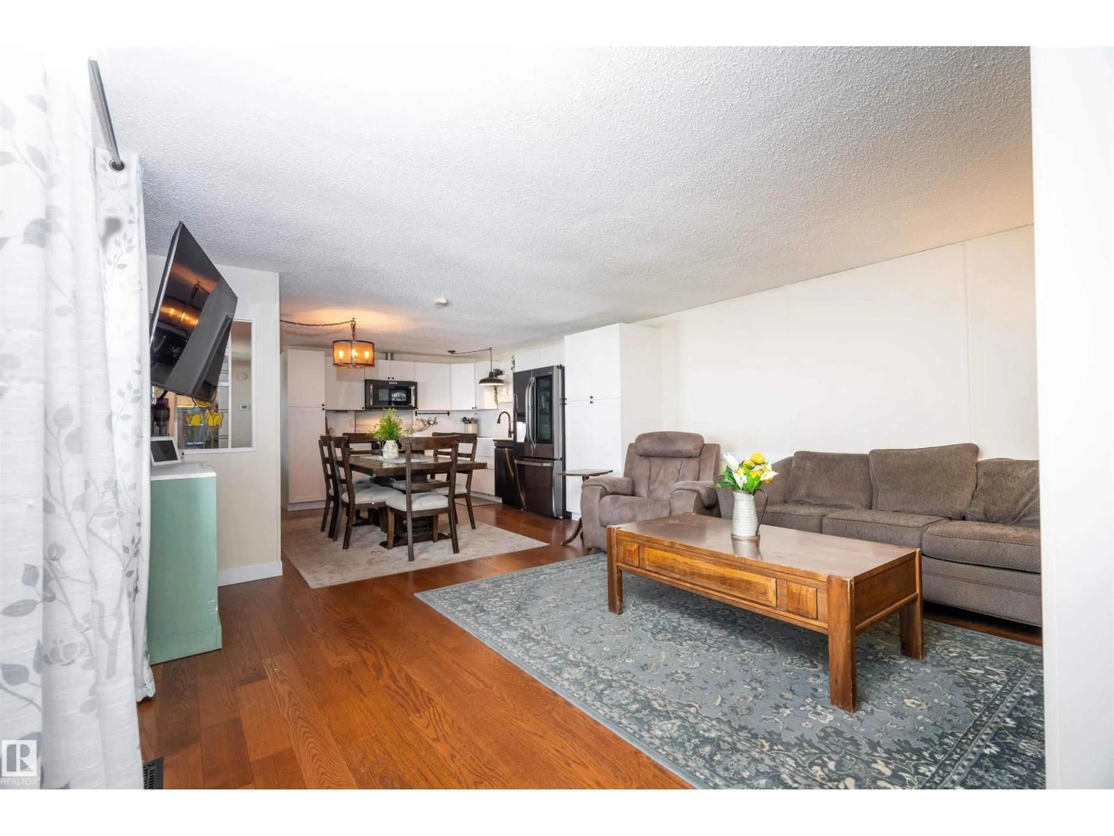 Living room with furniture, wood/laminate floor for 1215 LAKE VISTA CRESCENT, Sherwood Park Alberta T8H1K5