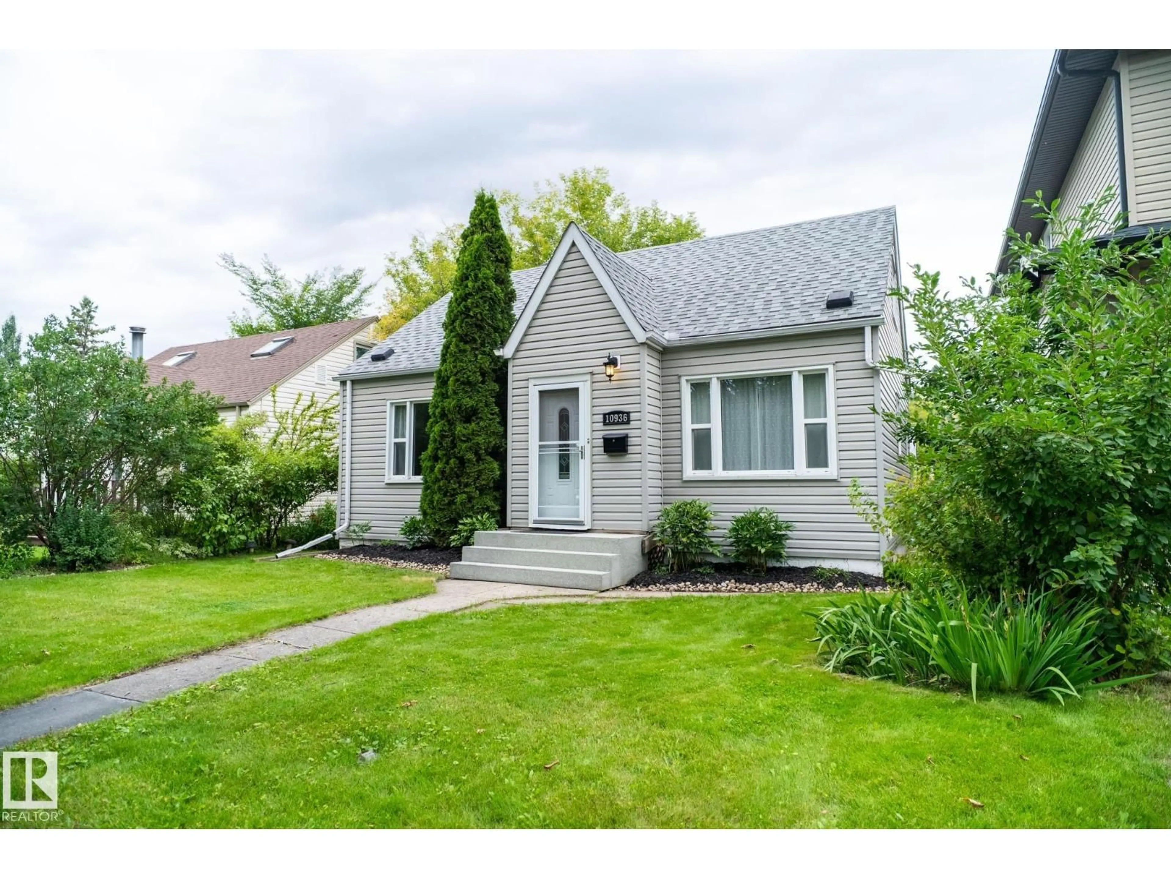 Home with vinyl exterior material, street for NW - 10936 70 AV, Edmonton Alberta T6H2G6