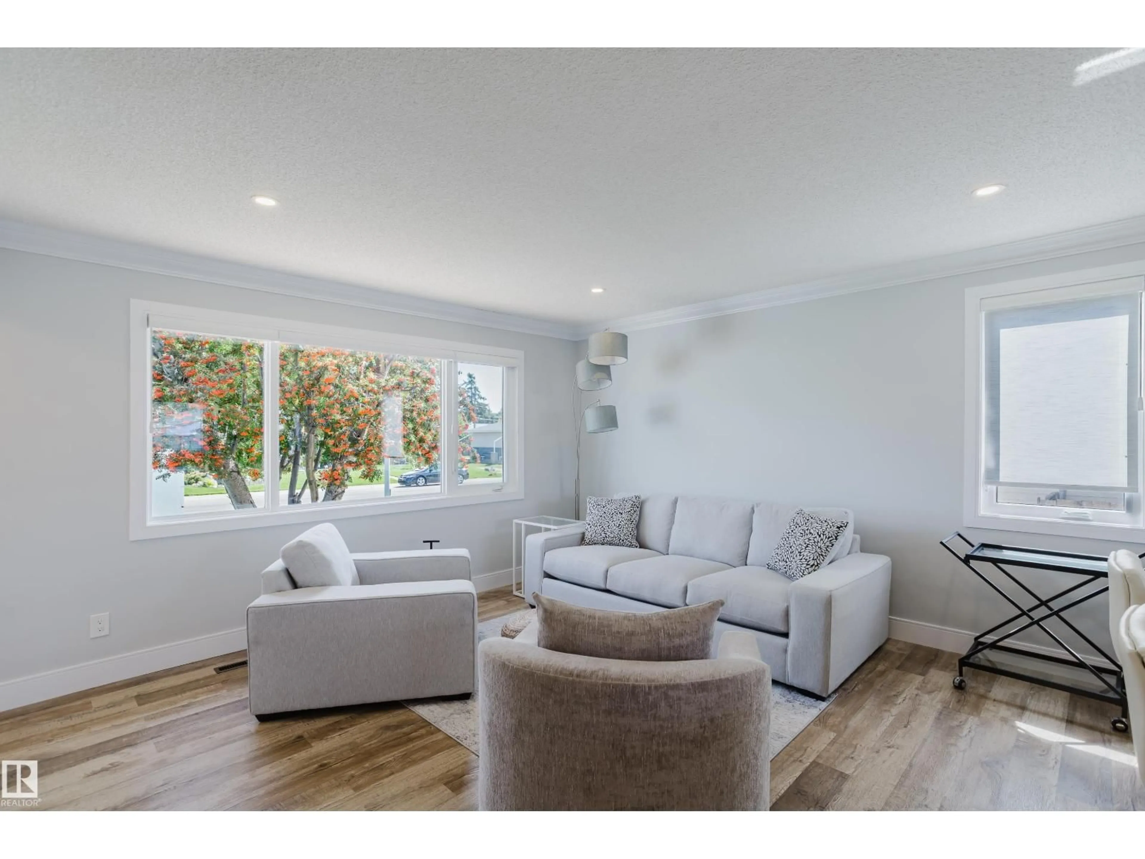 Living room with furniture, wood/laminate floor for 9330 162 ST, Edmonton Alberta T5R2M9