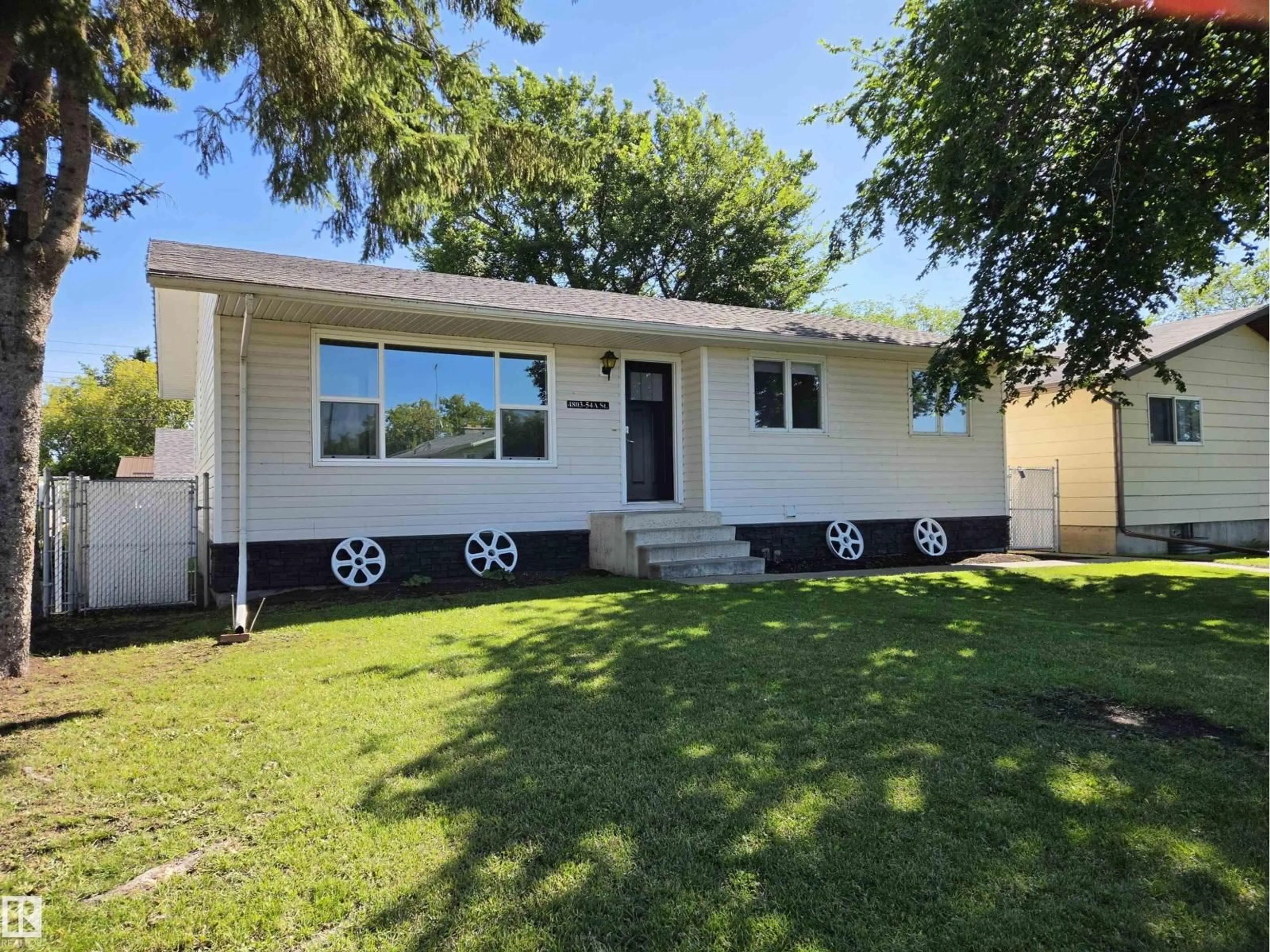Home with vinyl exterior material, street for 4803 54A ST, Bonnyville Town Alberta T9N1Z3