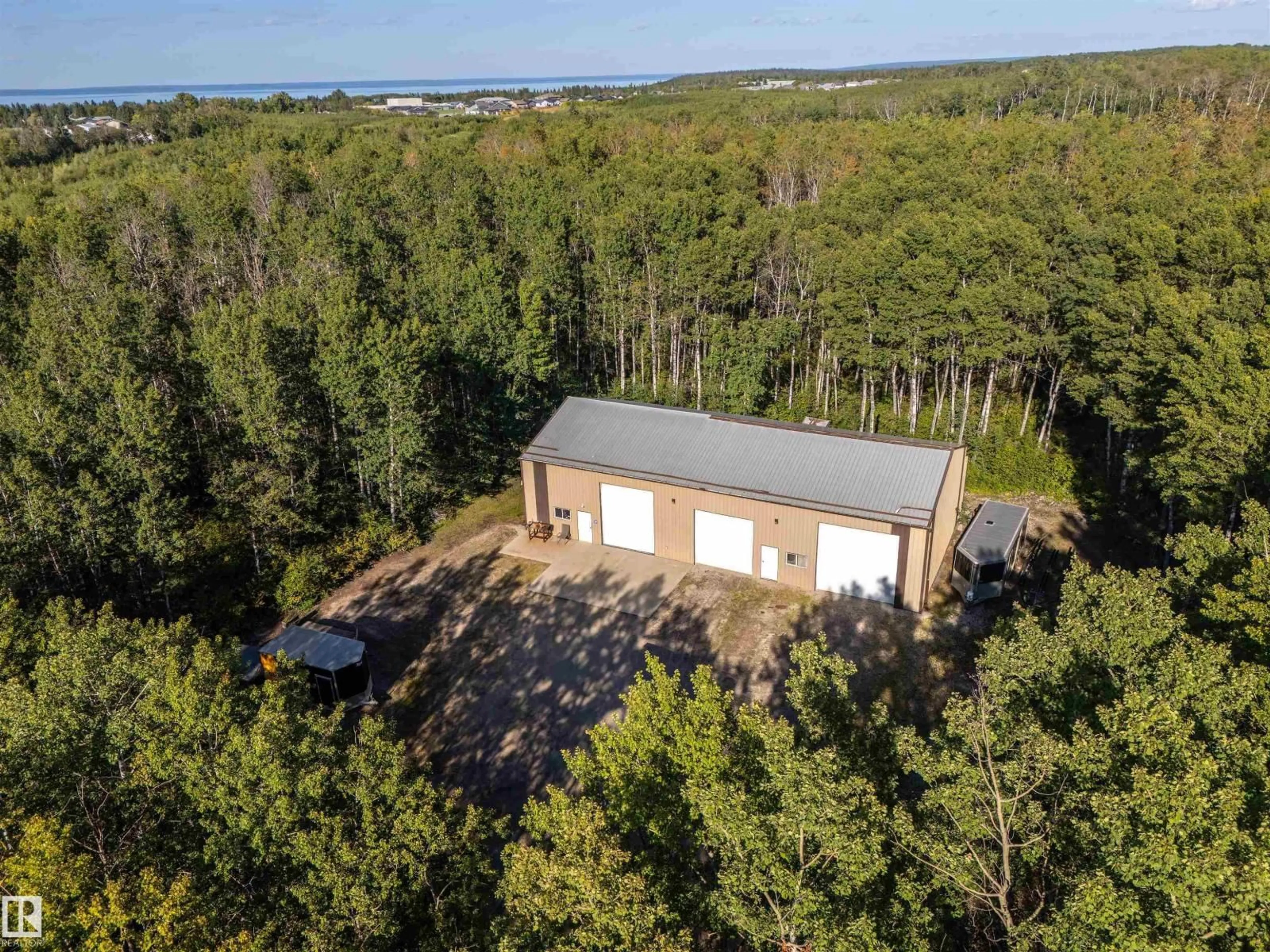 A pic from outside/outdoor area/front of a property/back of a property/a pic from drone, forest/trees view for 7812 16 ST, Cold Lake Alberta T9M1B5