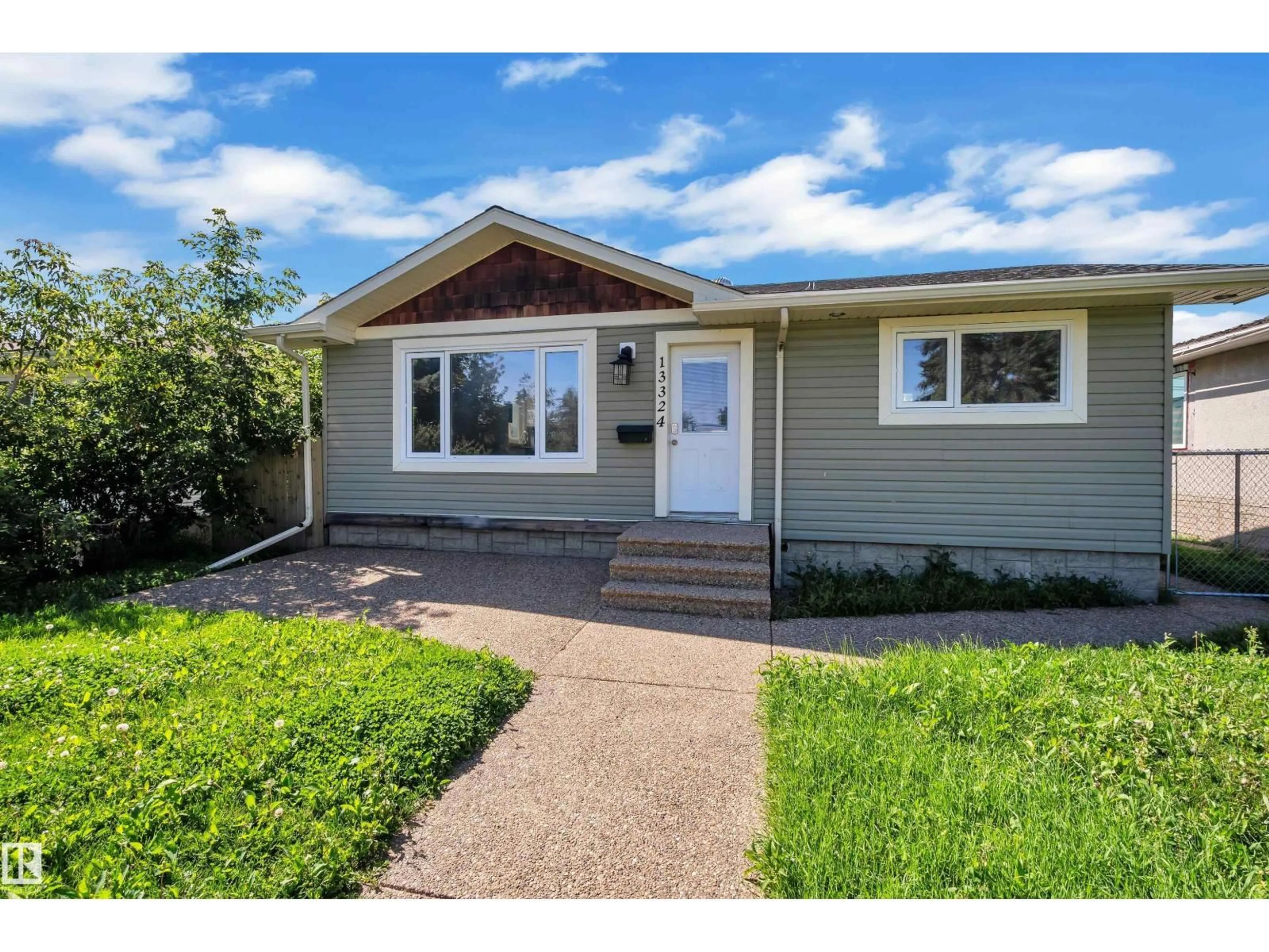 Home with vinyl exterior material, street for NW - 13324 62 ST, Edmonton Alberta T5A0V6