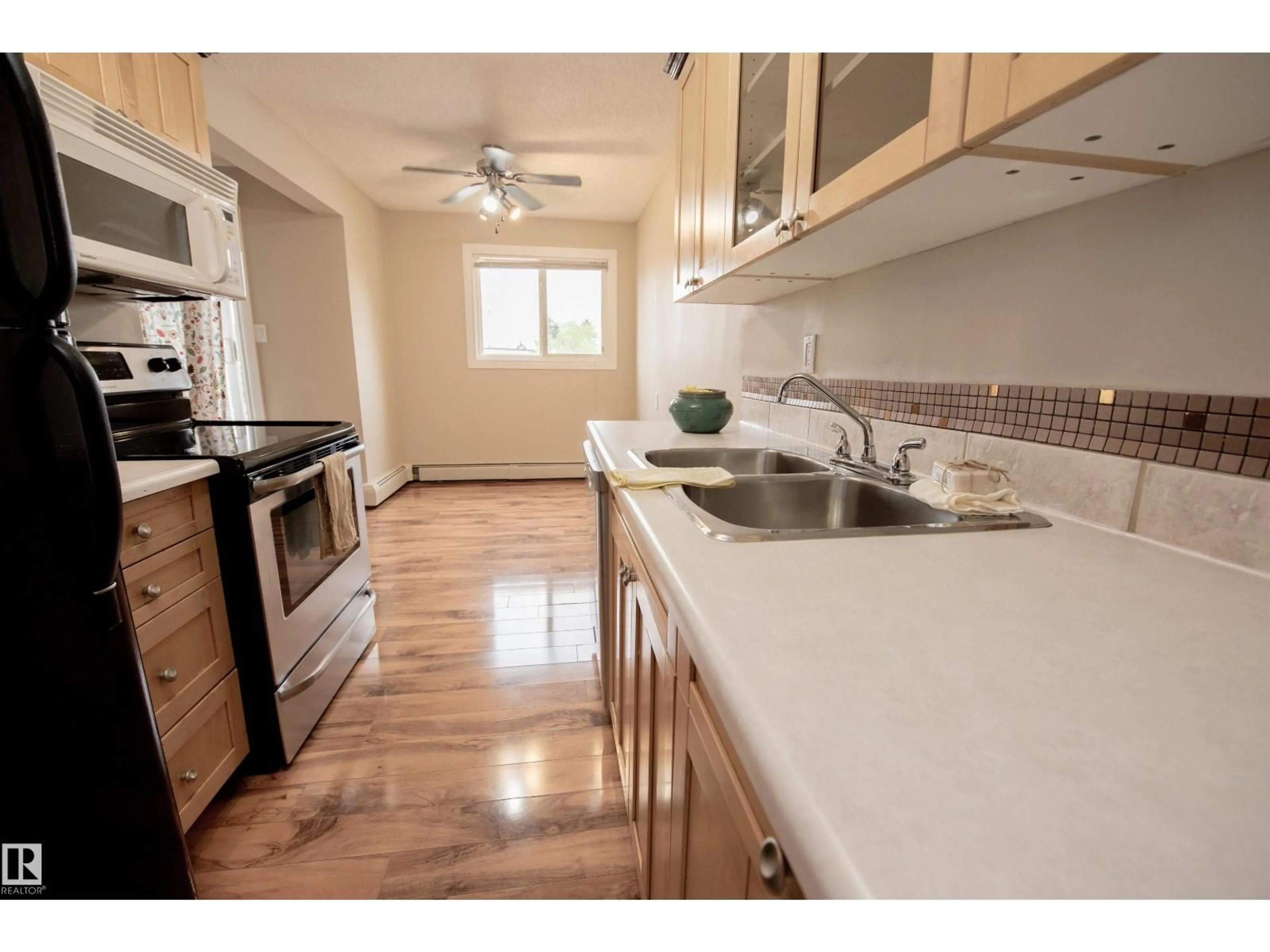 Standard kitchen, wood/laminate floor for #304 - 3835 107 ST, Edmonton Alberta T6J2N7