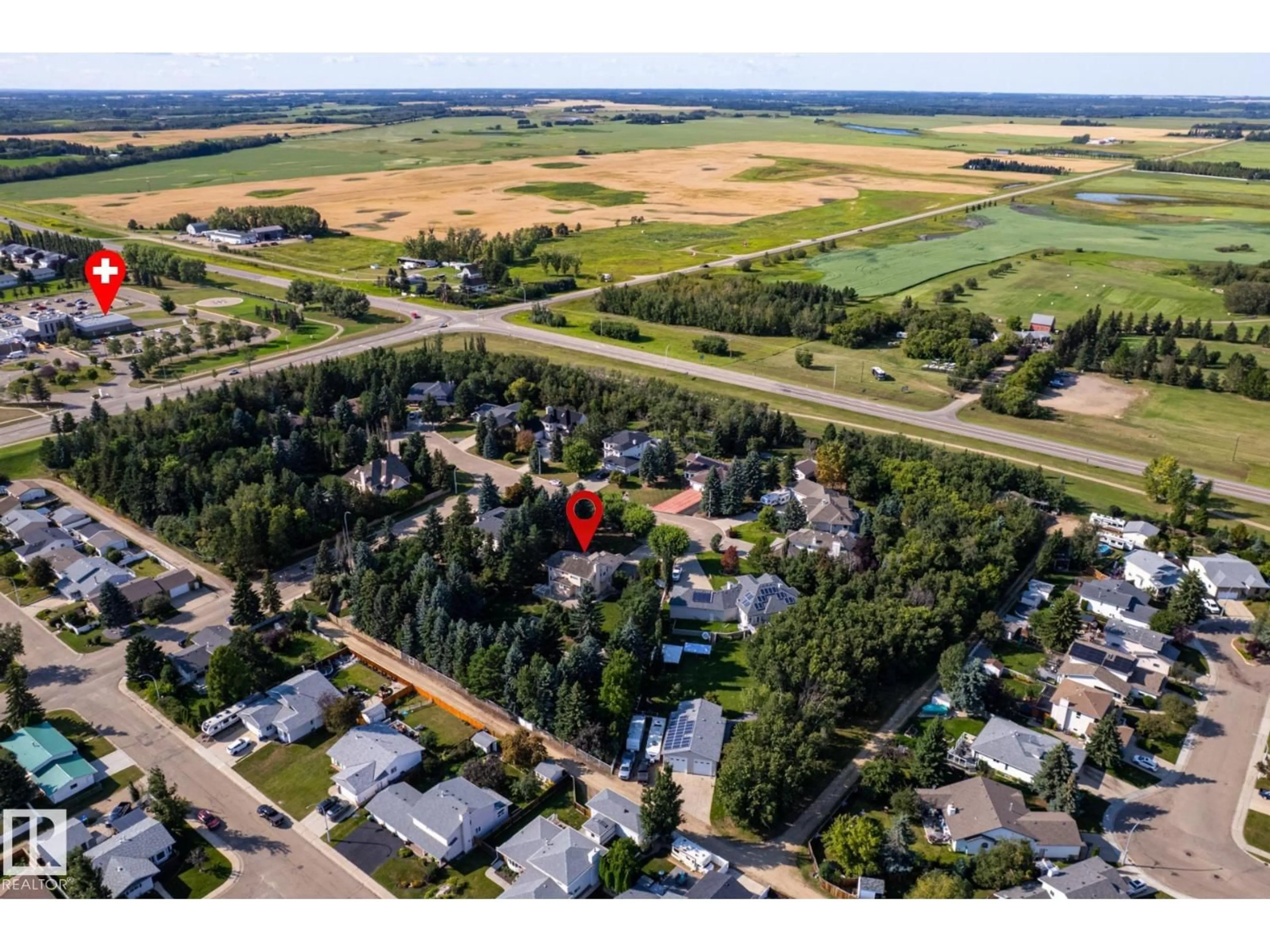 A pic from outside/outdoor area/front of a property/back of a property/a pic from drone, street for 14 HIGHLANDS PL, Wetaskiwin Alberta T9A3G9