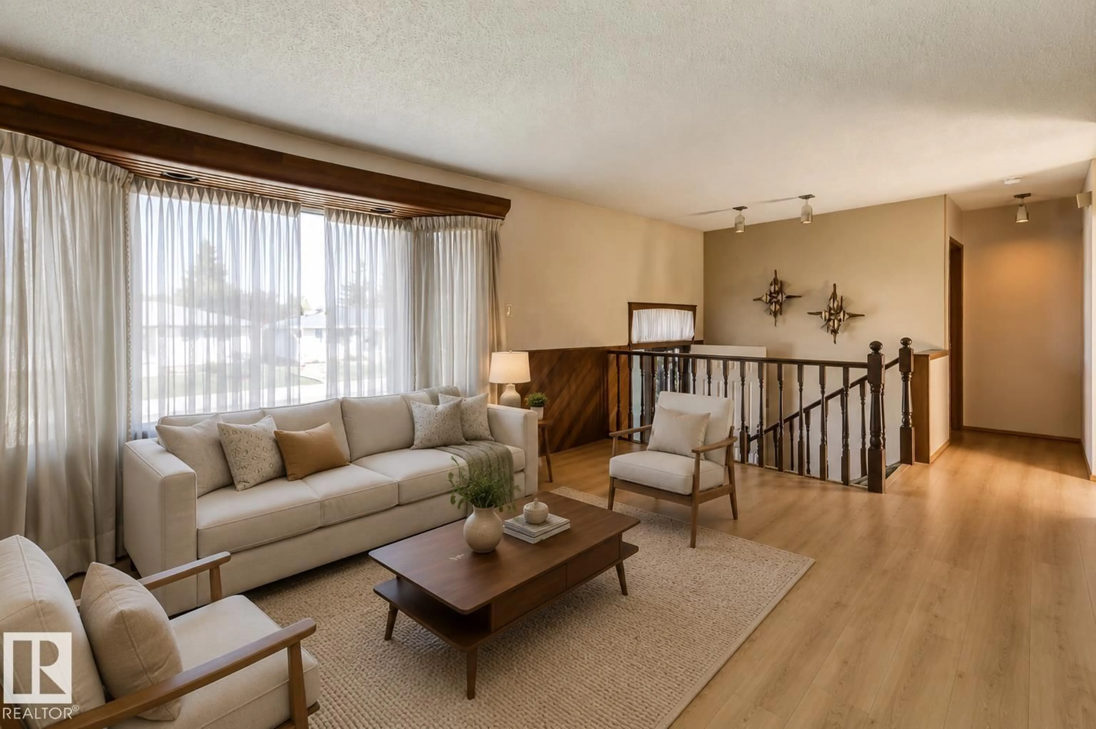 Living room with furniture, wood/laminate floor for 5811 92 AV, Edmonton Alberta T6B2G9