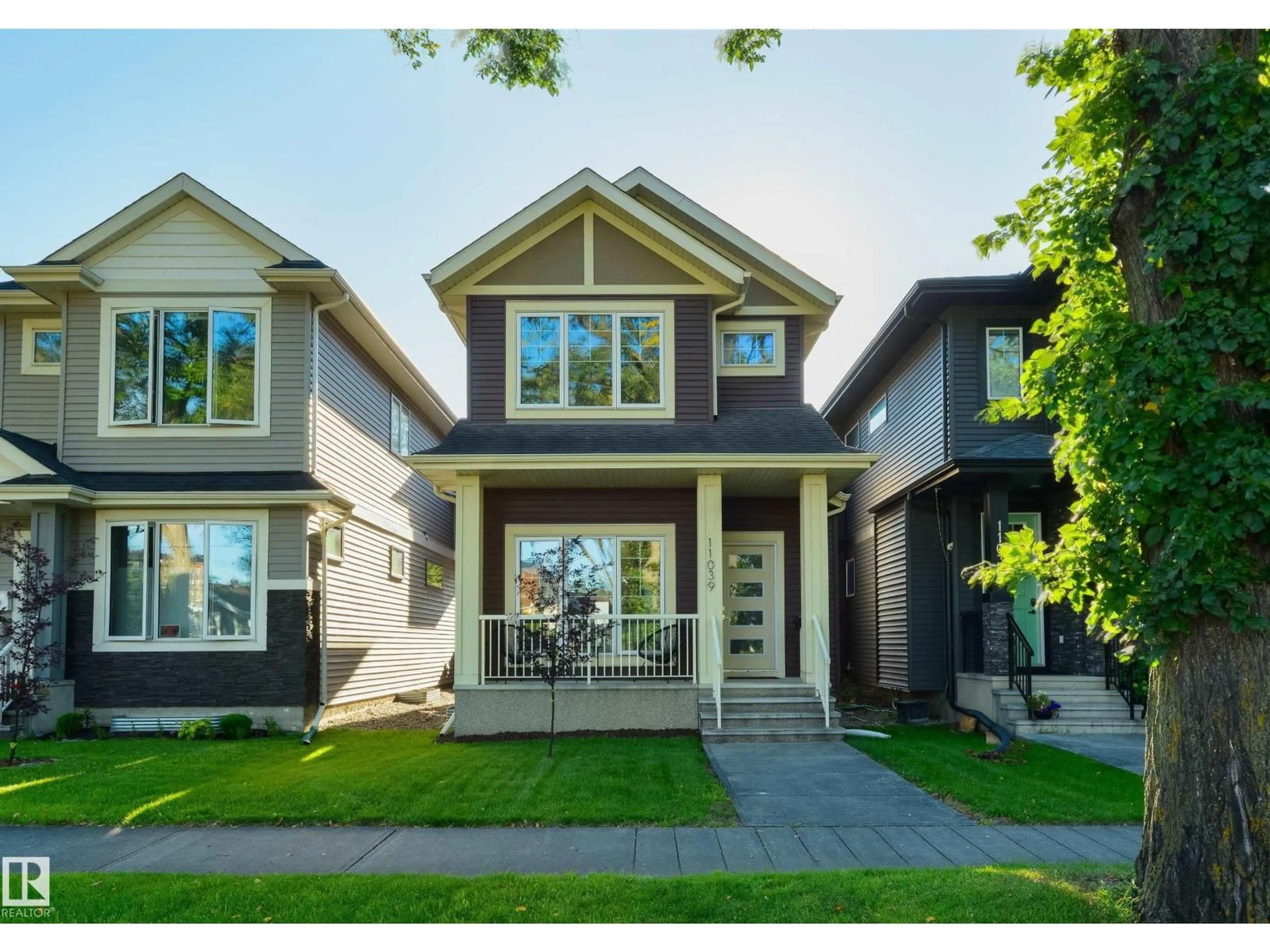 Home with vinyl exterior material, street for 11039 126 ST, Edmonton Alberta T5M0P8