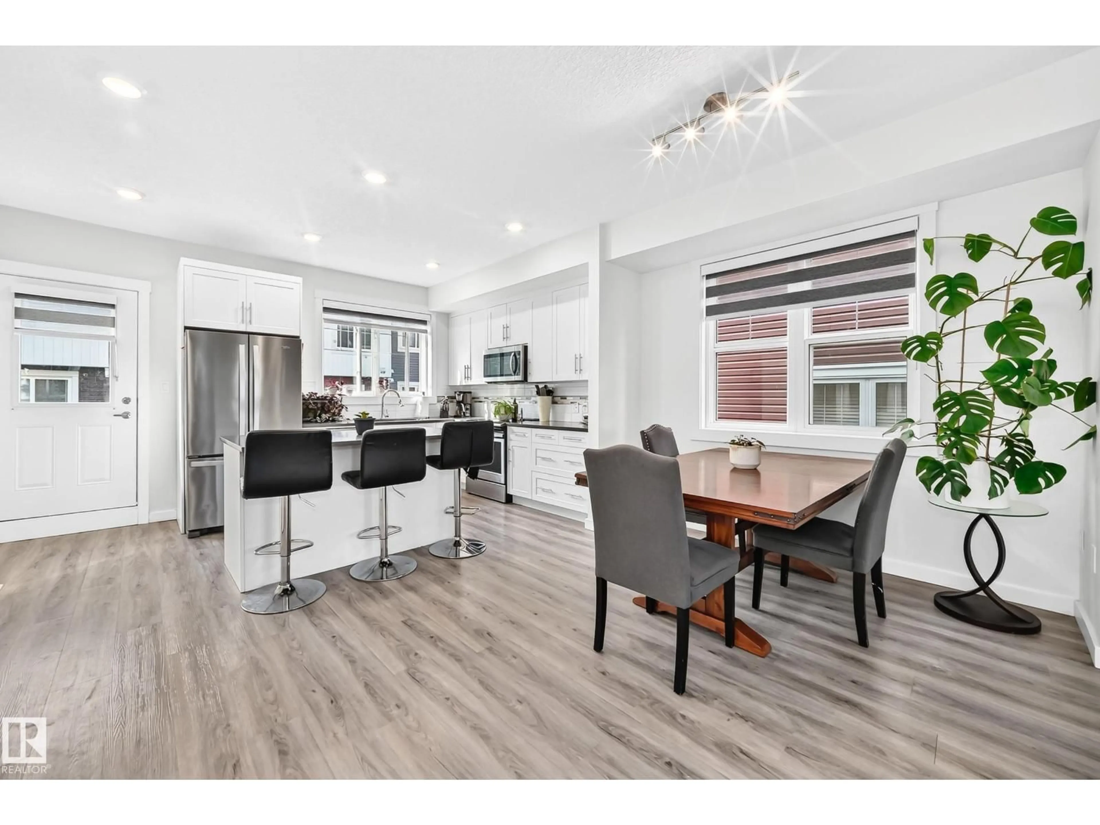 Open concept kitchen, wood/laminate floor for #23 - 903 CRYSTALLINA NERA WY, Edmonton Alberta T5Z0N6