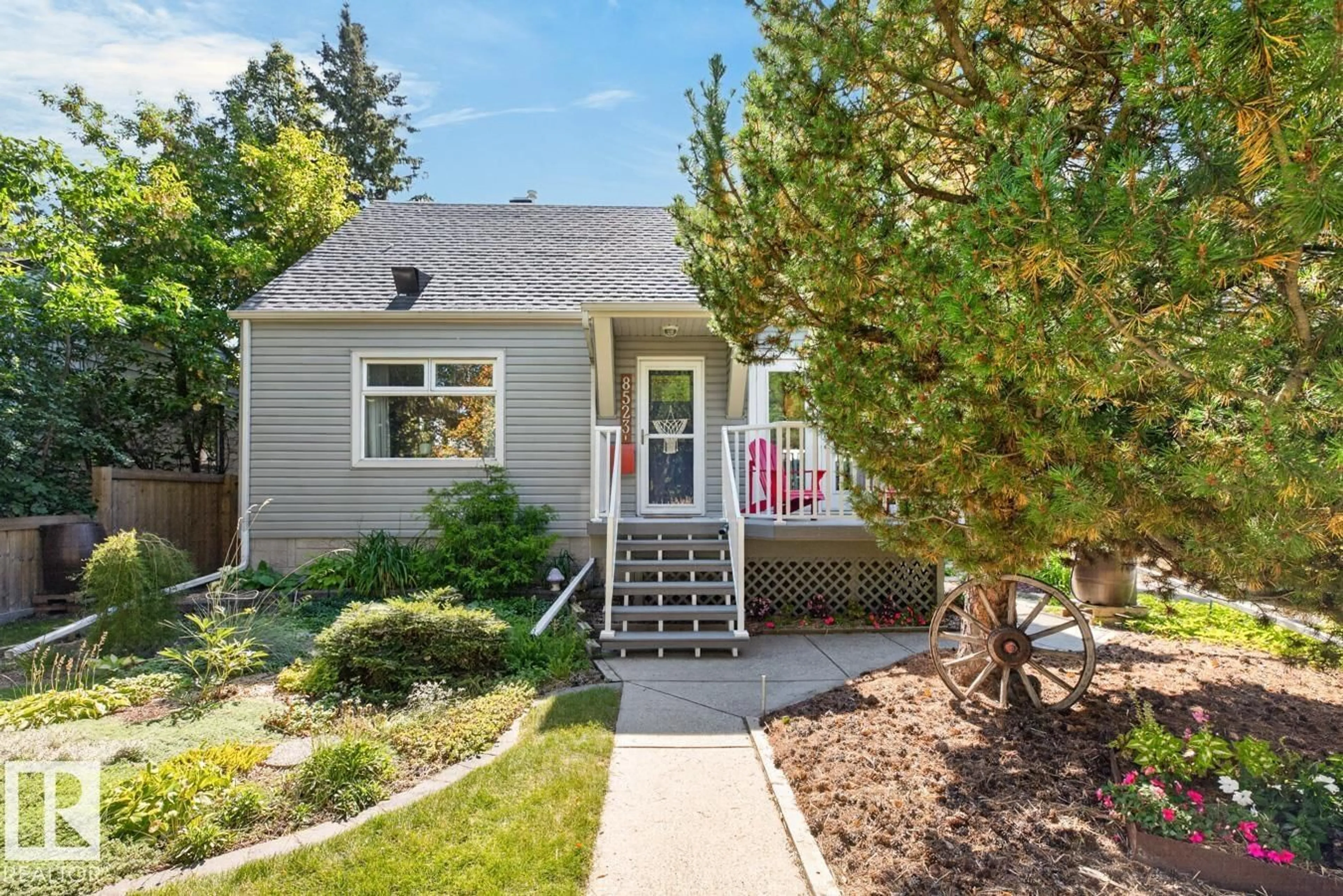 Home with vinyl exterior material, street for 8523 84 AV, Edmonton Alberta T6C1C8