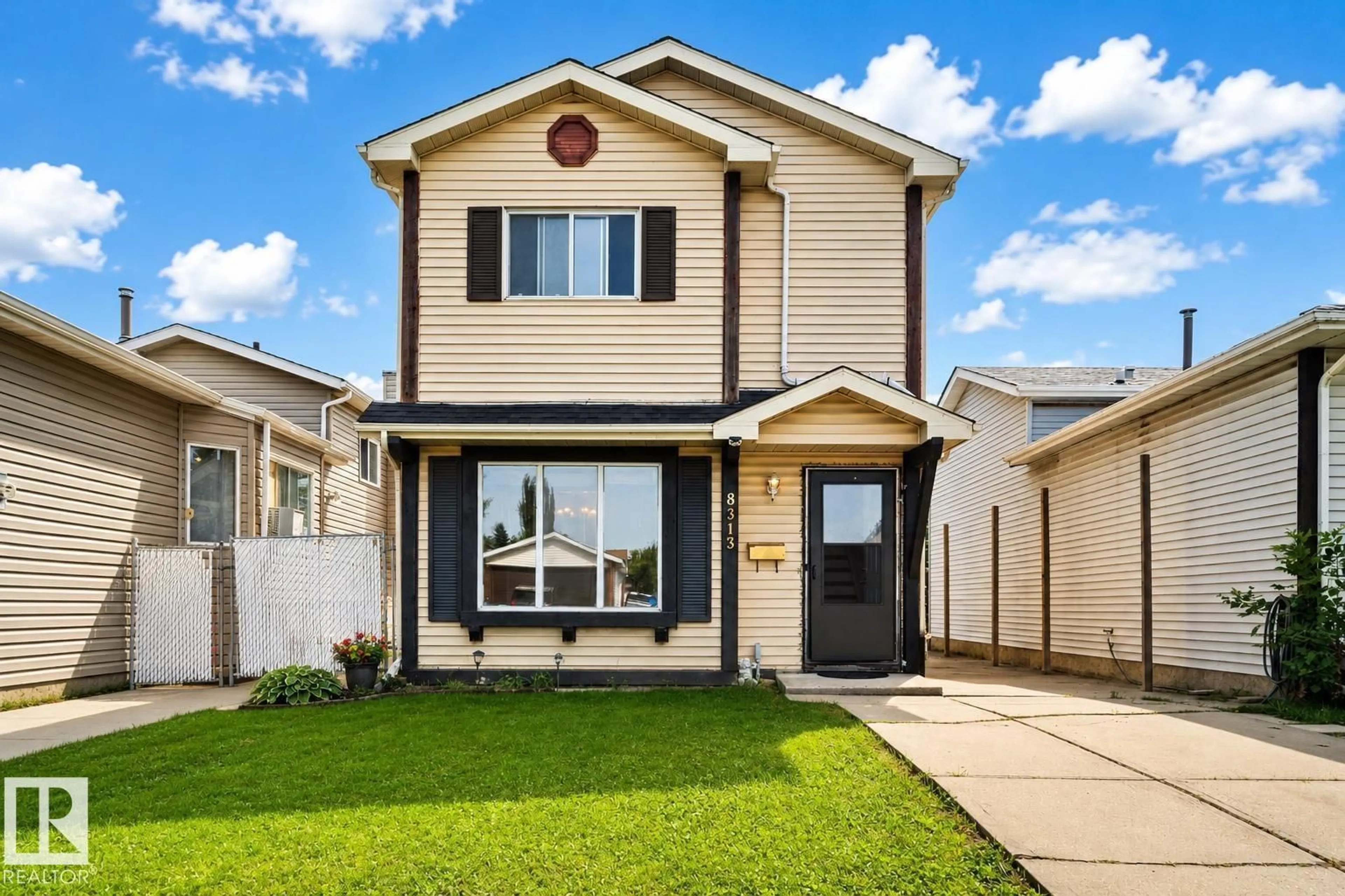 Home with vinyl exterior material, street for 8313 156 AV, Edmonton Alberta T5Z2R3