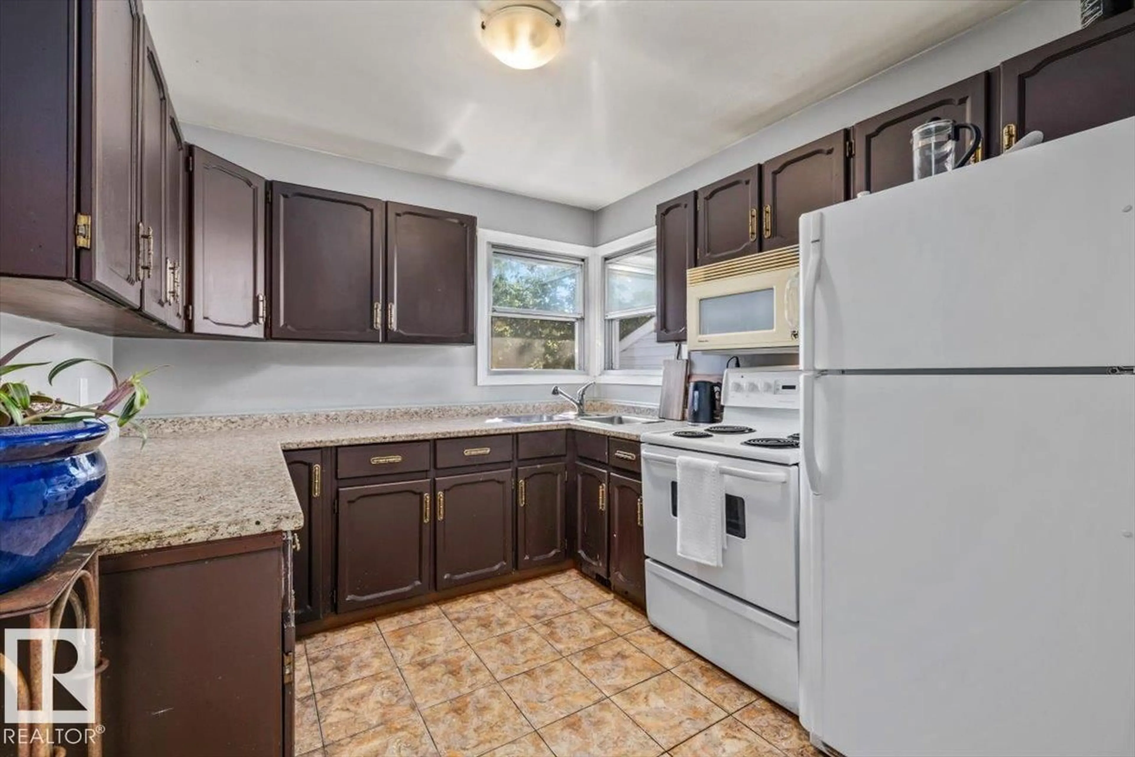 Standard kitchen, ceramic/tile floor for 10990 135 ST, Edmonton Alberta T5M1K2