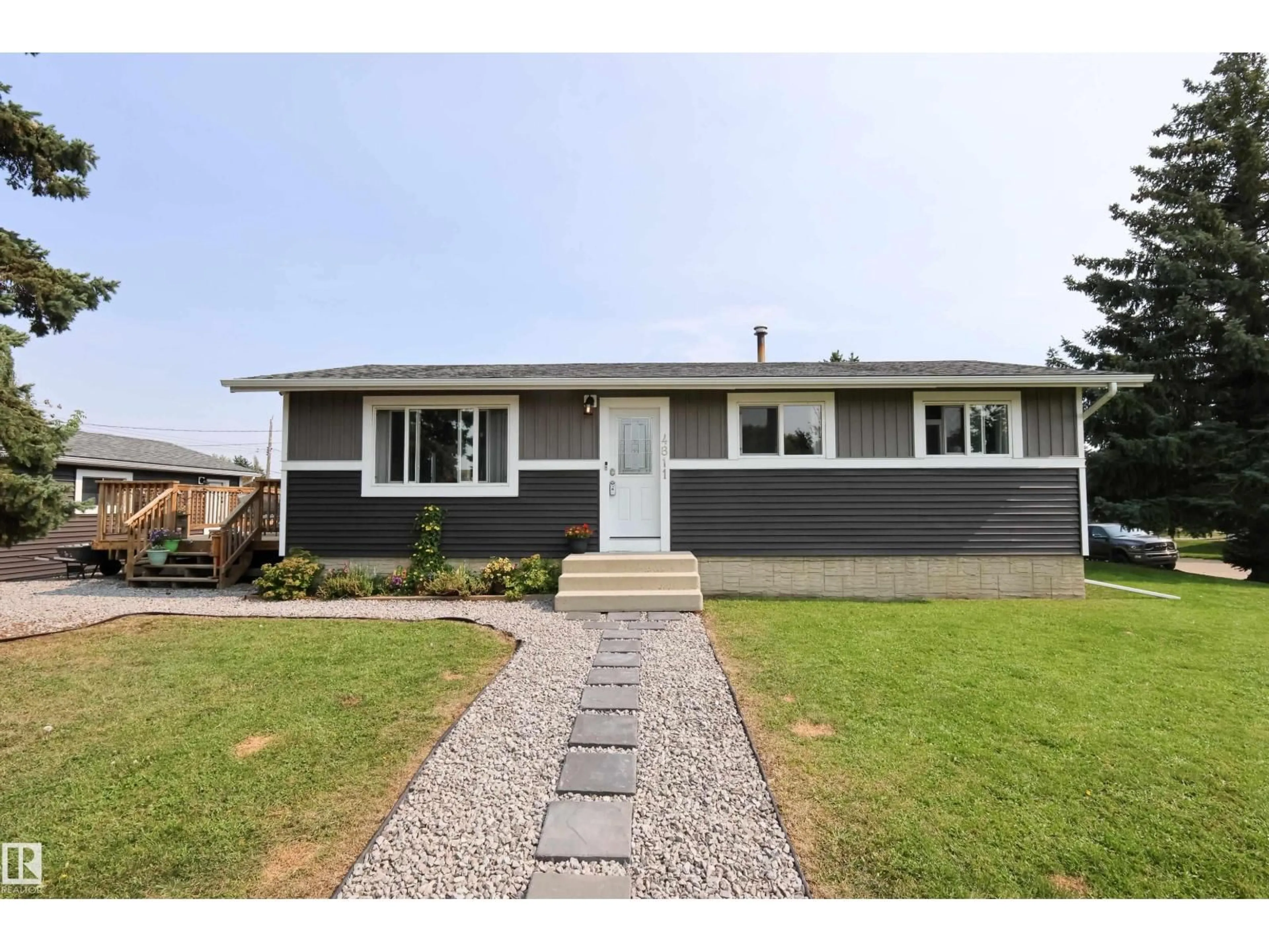 Home with vinyl exterior material, street for 4811 50 ST, Legal Alberta T0G1L0