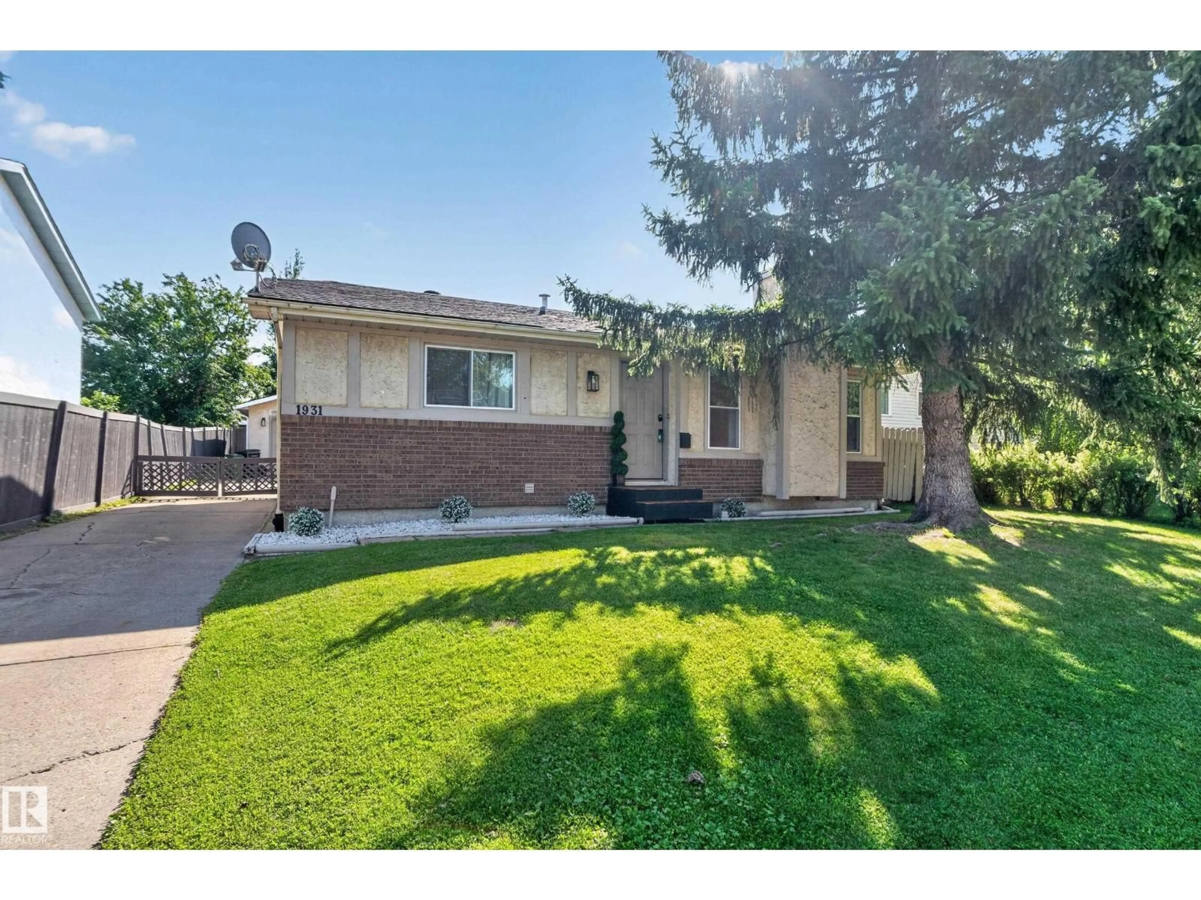 Home with vinyl exterior material, street for 1931 145A AV, Edmonton Alberta T5Y1S9