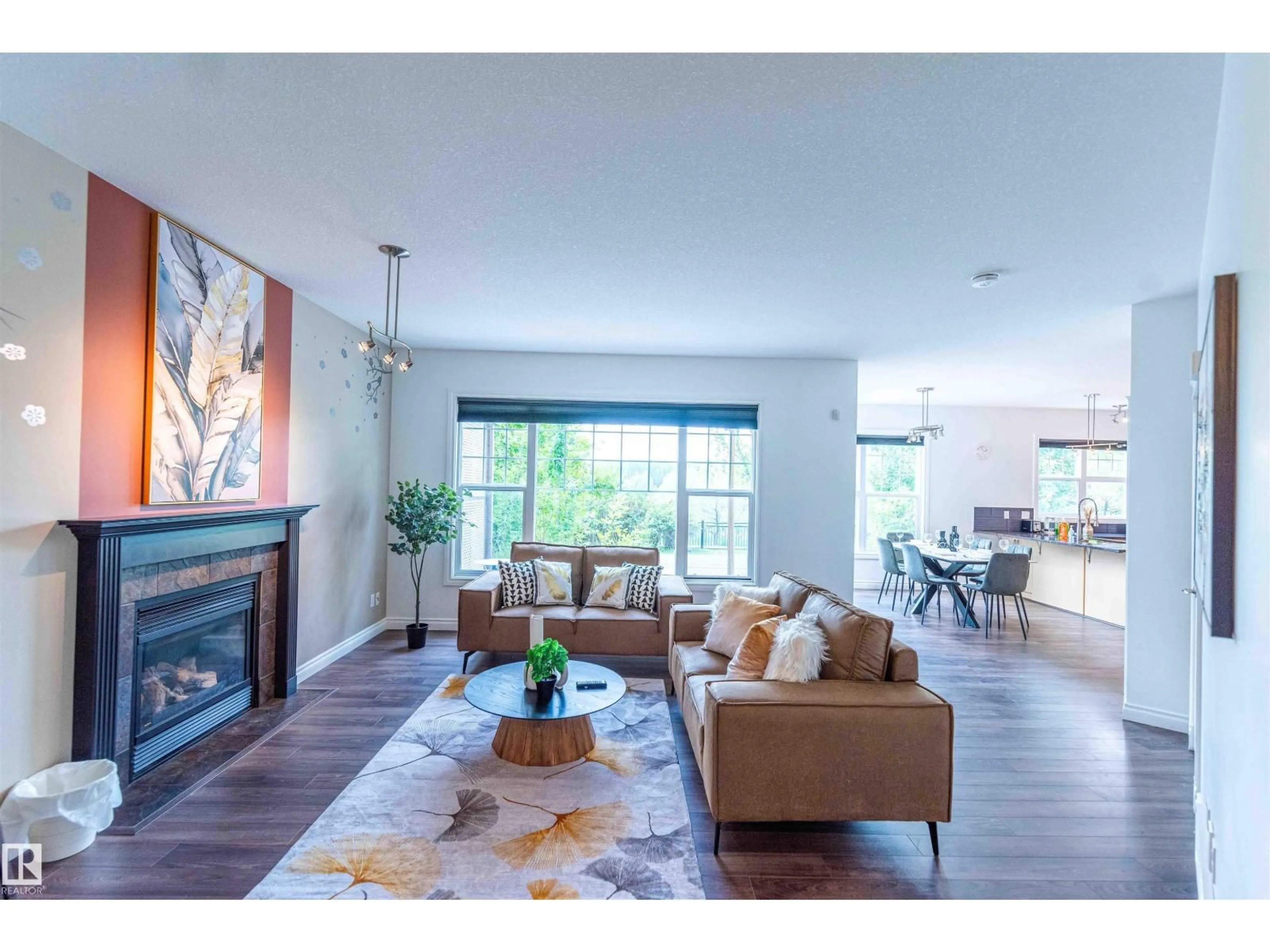 Living room with furniture, wood/laminate floor for 5092 THIBAULT WY, Edmonton Alberta T6R3J3