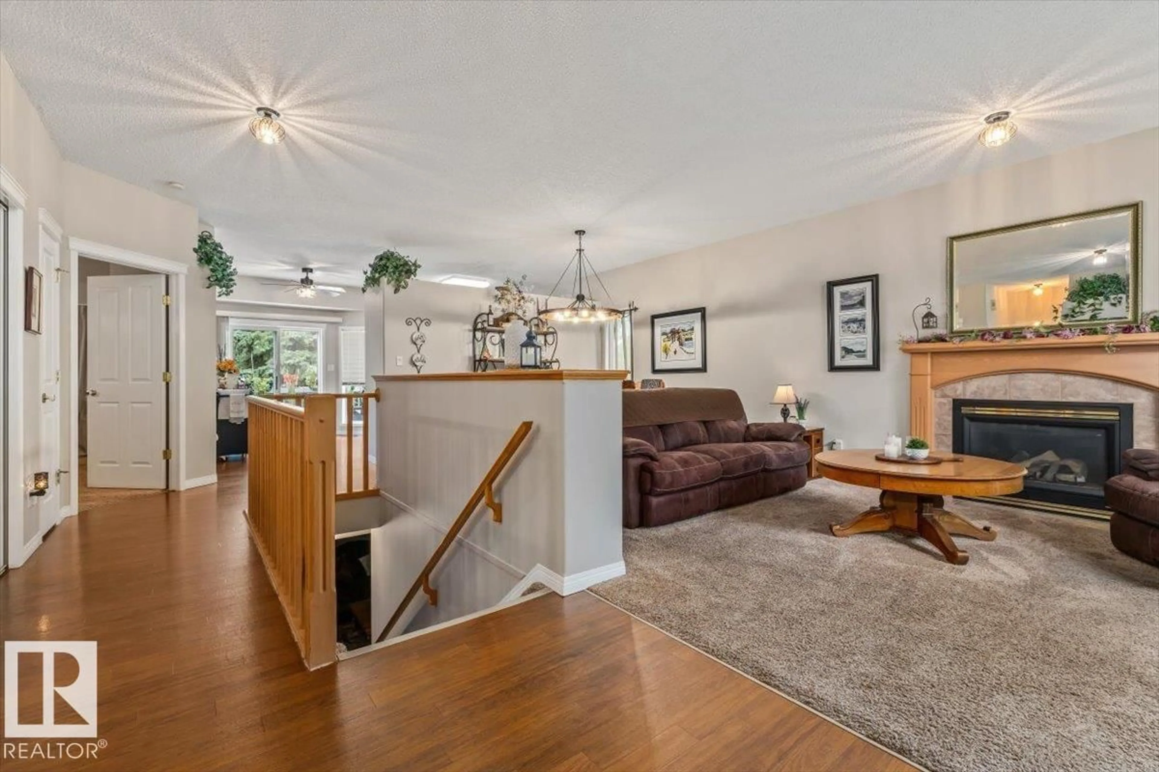 Living room with furniture, wood/laminate floor for 1 LONGVIEW PL, Spruce Grove Alberta T7X3Y5