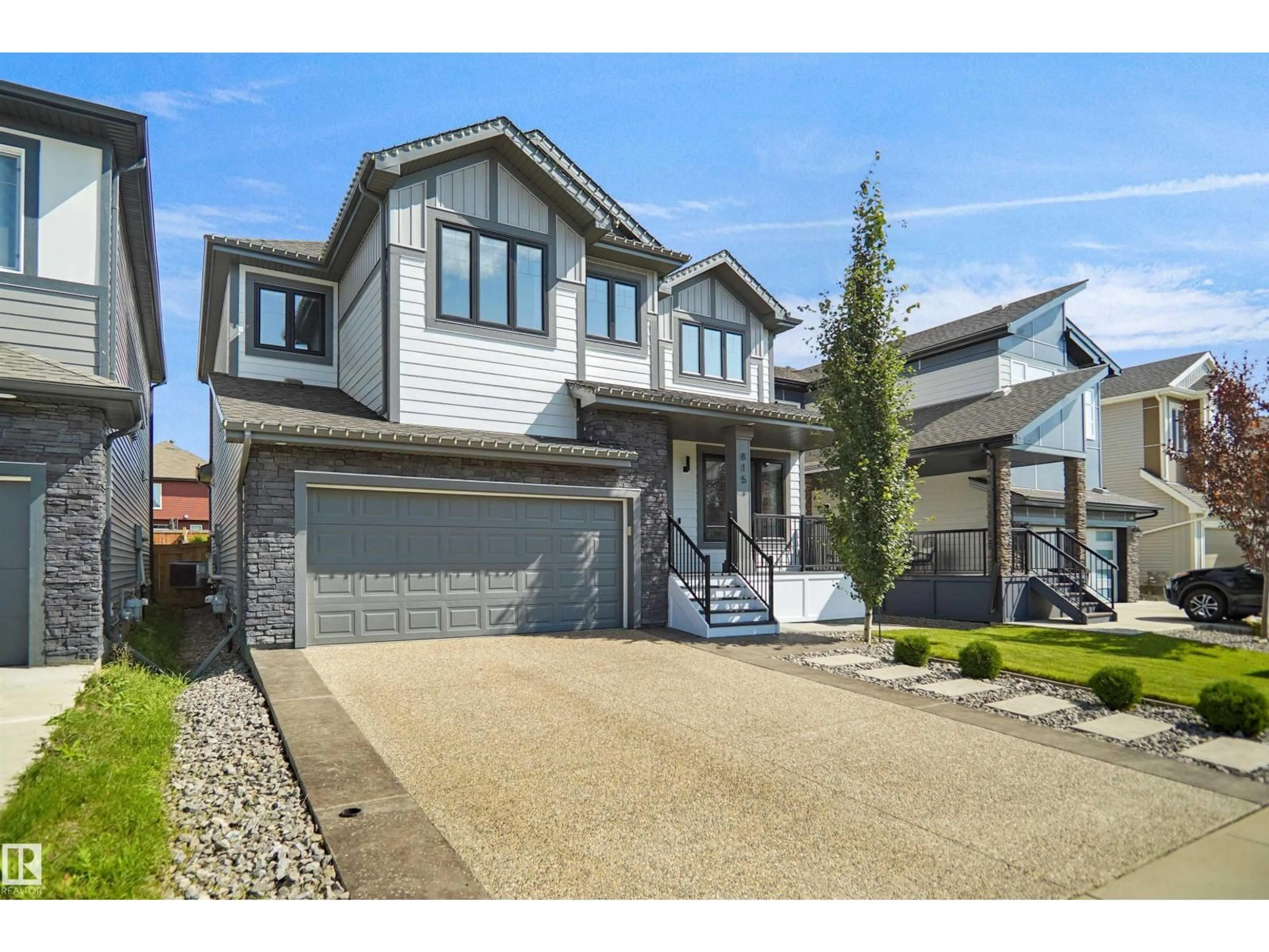 Home with vinyl exterior material, street for SW - 815 176 ST, Edmonton Alberta T6W2X3