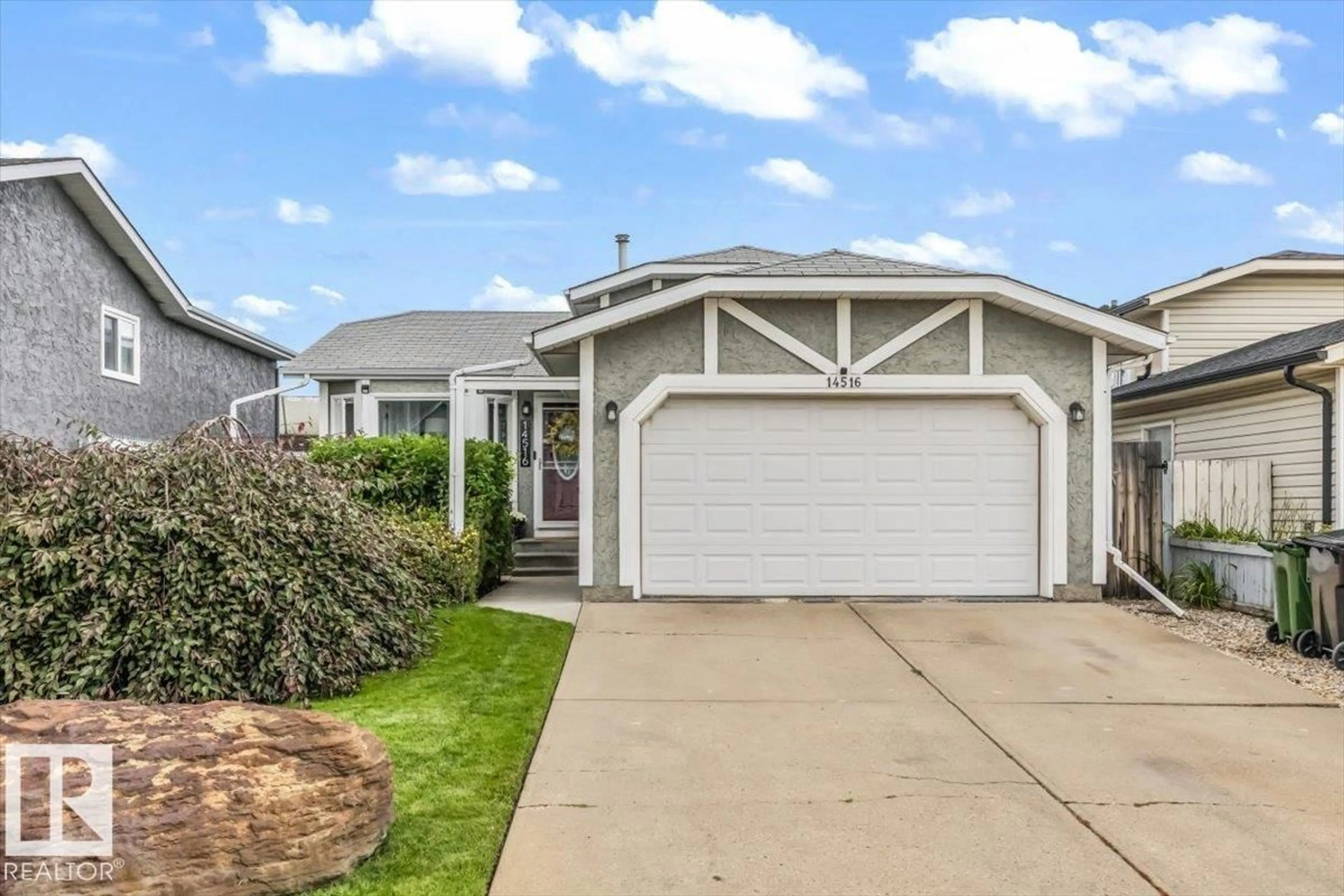 Home with vinyl exterior material, street for 14516 37 ST, Edmonton Alberta T5Y2K2