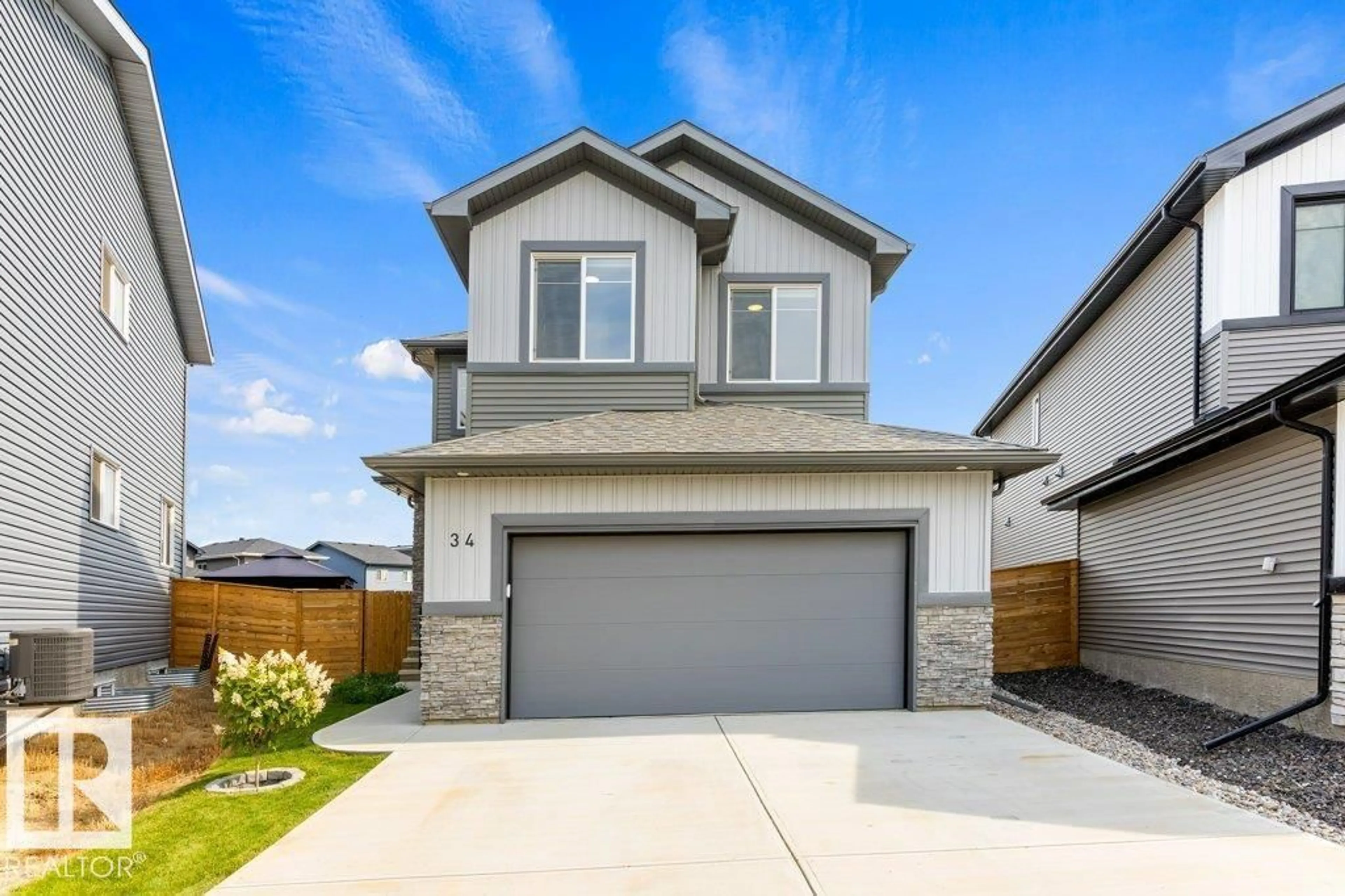 Home with vinyl exterior material, street for 34 RASPBERRY RD, St. Albert Alberta T8N8A3