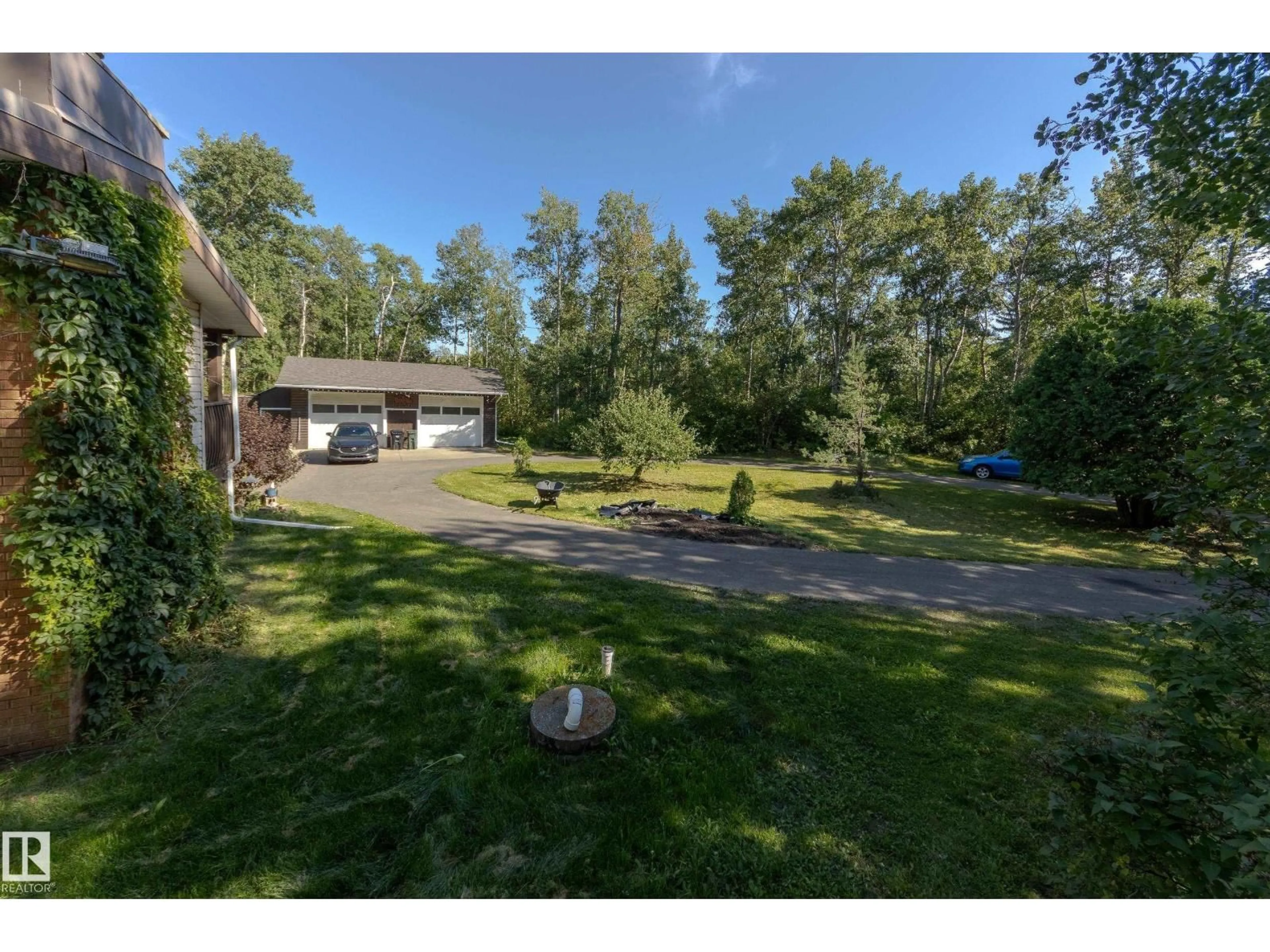 A pic from outside/outdoor area/front of a property/back of a property/a pic from drone, water/lake/river/ocean view for 253 - 52313 RGE ROAD 232, Rural Strathcona County Alberta T8B1B7