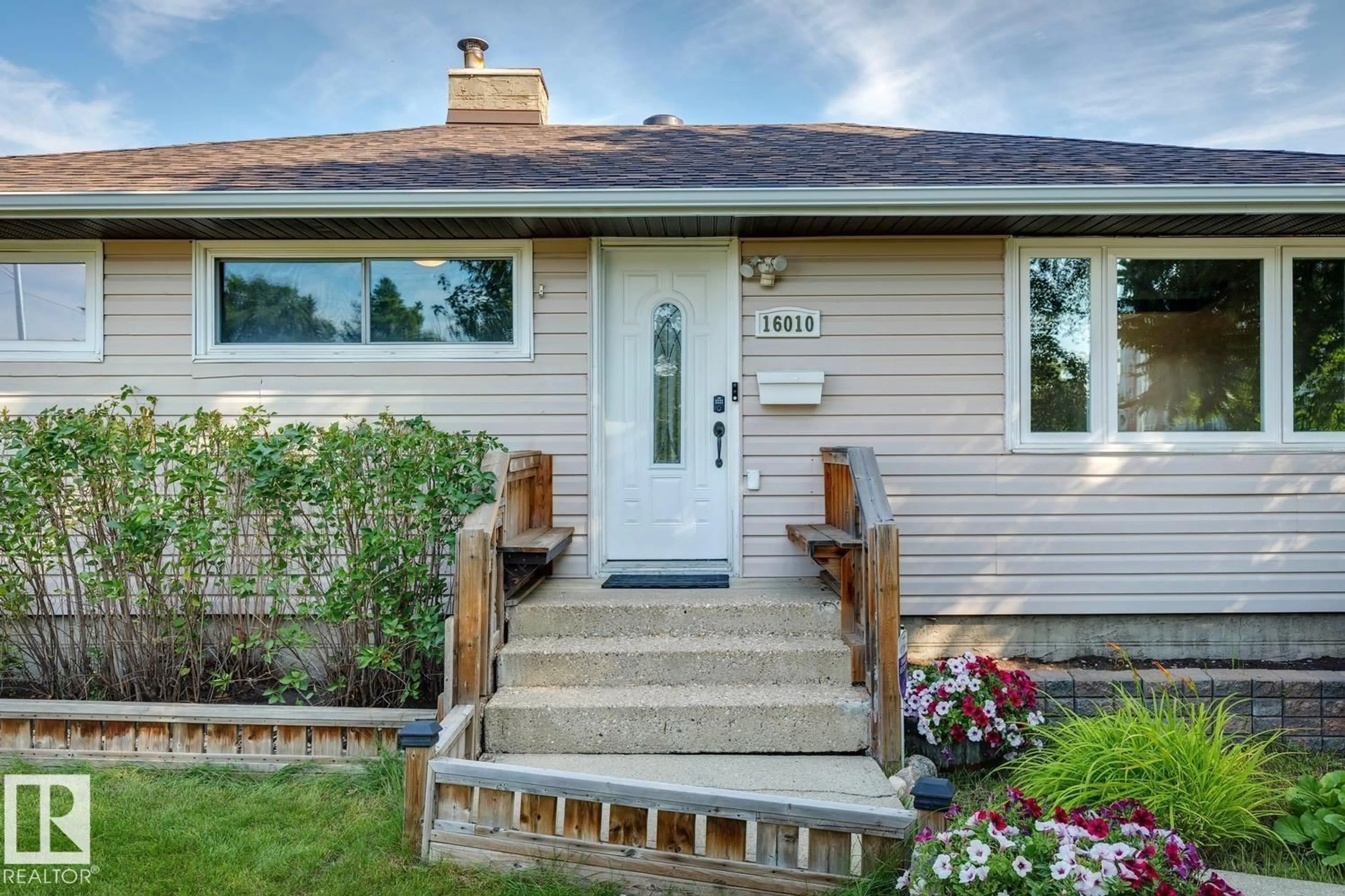 Home with vinyl exterior material, street for NW - 16010 87 AV, Edmonton Alberta T5R4G9