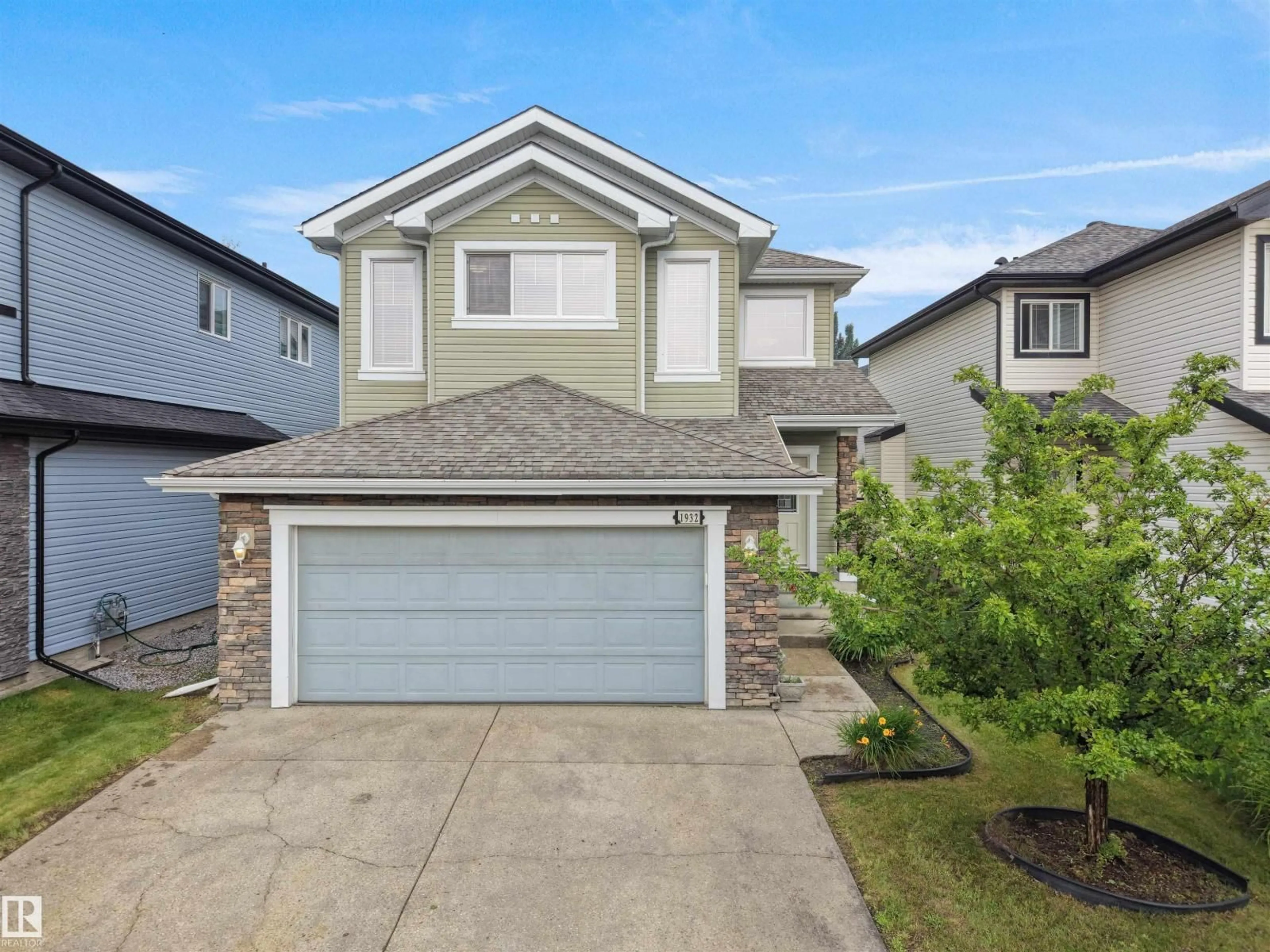 Home with vinyl exterior material, street for SW - 1932 67 ST, Edmonton Alberta T6X0L9